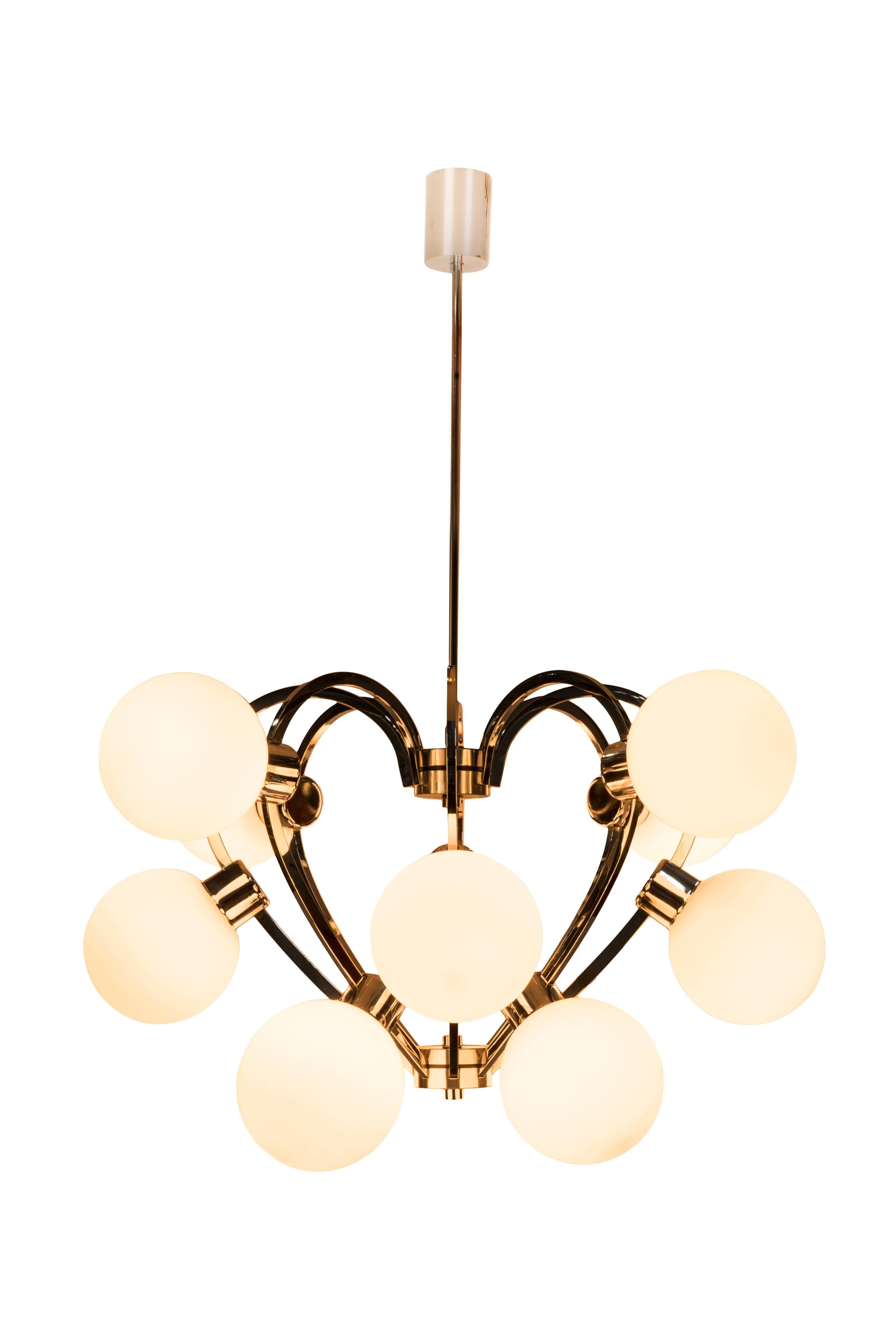 This superb 1970s Mid-Century Modernist Sputnik chandelier features an heart shape form design on a chrome frame with (12) opal glass globes.

Made in Germany, circa 1970

Measures: 16 1/2