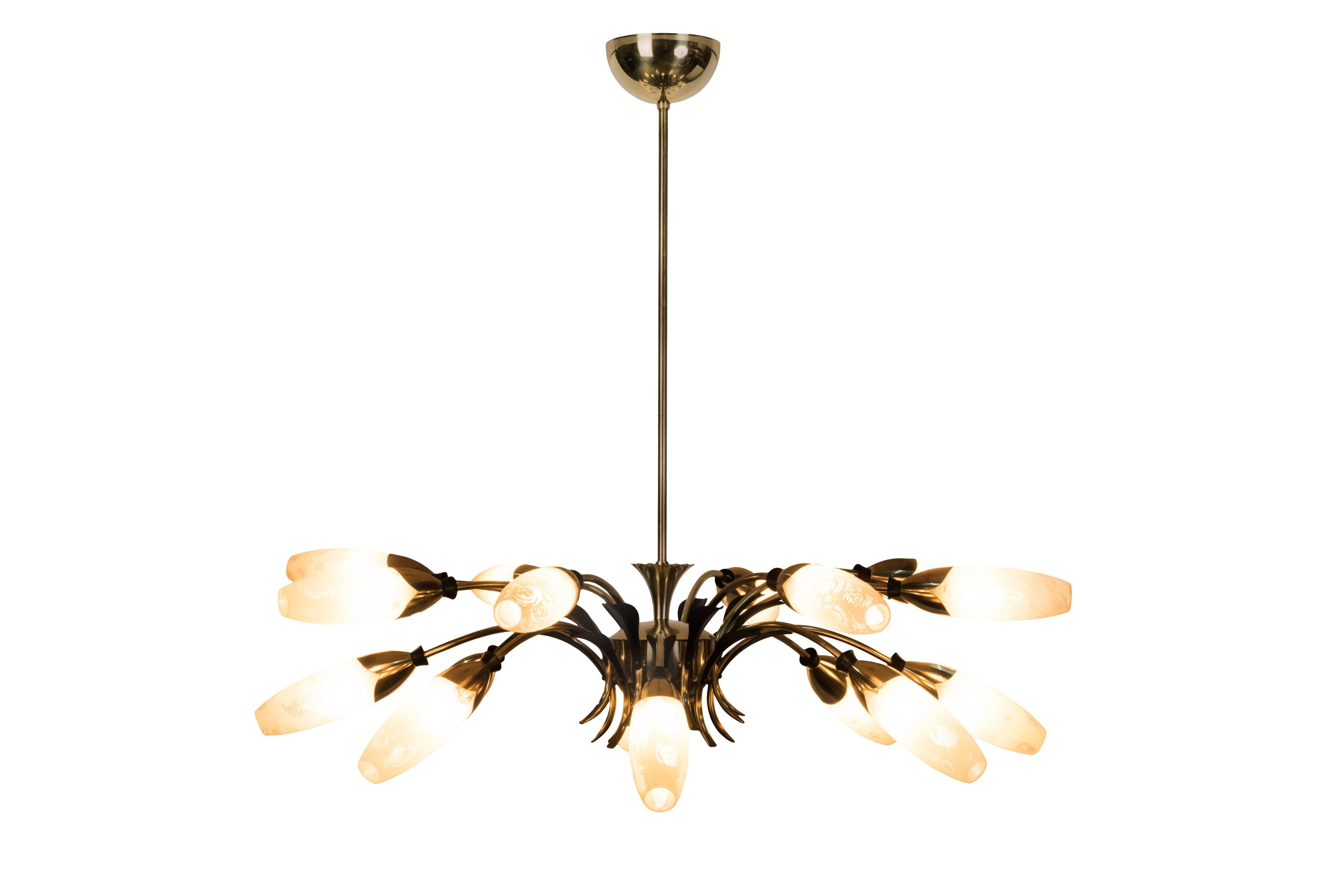 This spectacular 1950s Sputnik spider chandelier features a sixteen arms brass frame with leafs and rings details in black enamel and a floral motif glass shades in enamel pearl color. The piece cascades in two levels.

Made in Austria, circa