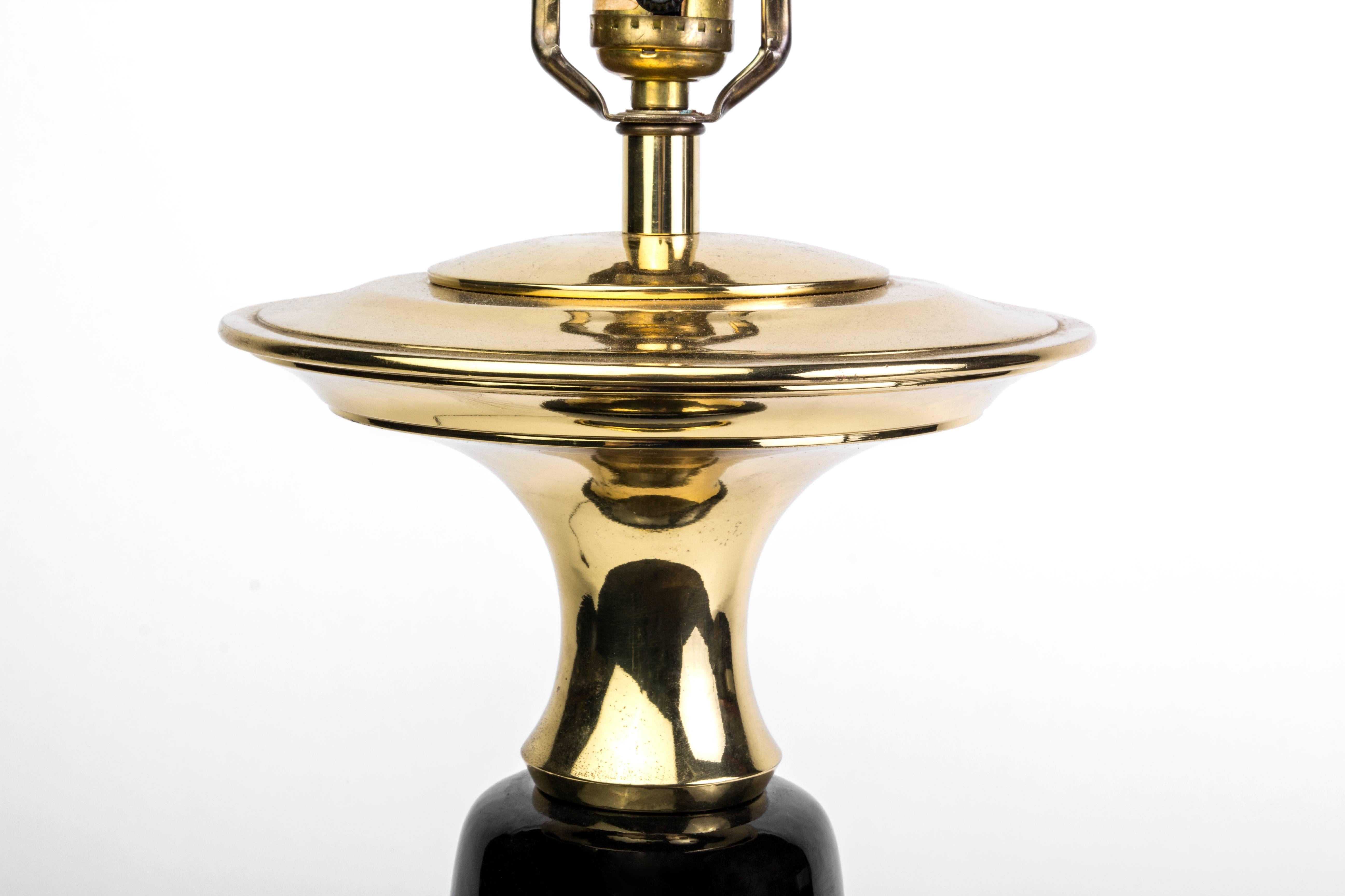 This beautiful Art Deco style table lamp was designed by Chapman. It features brass and black ceramic detailing giving it a gorgeous luster. It is in excellent vintage condition.