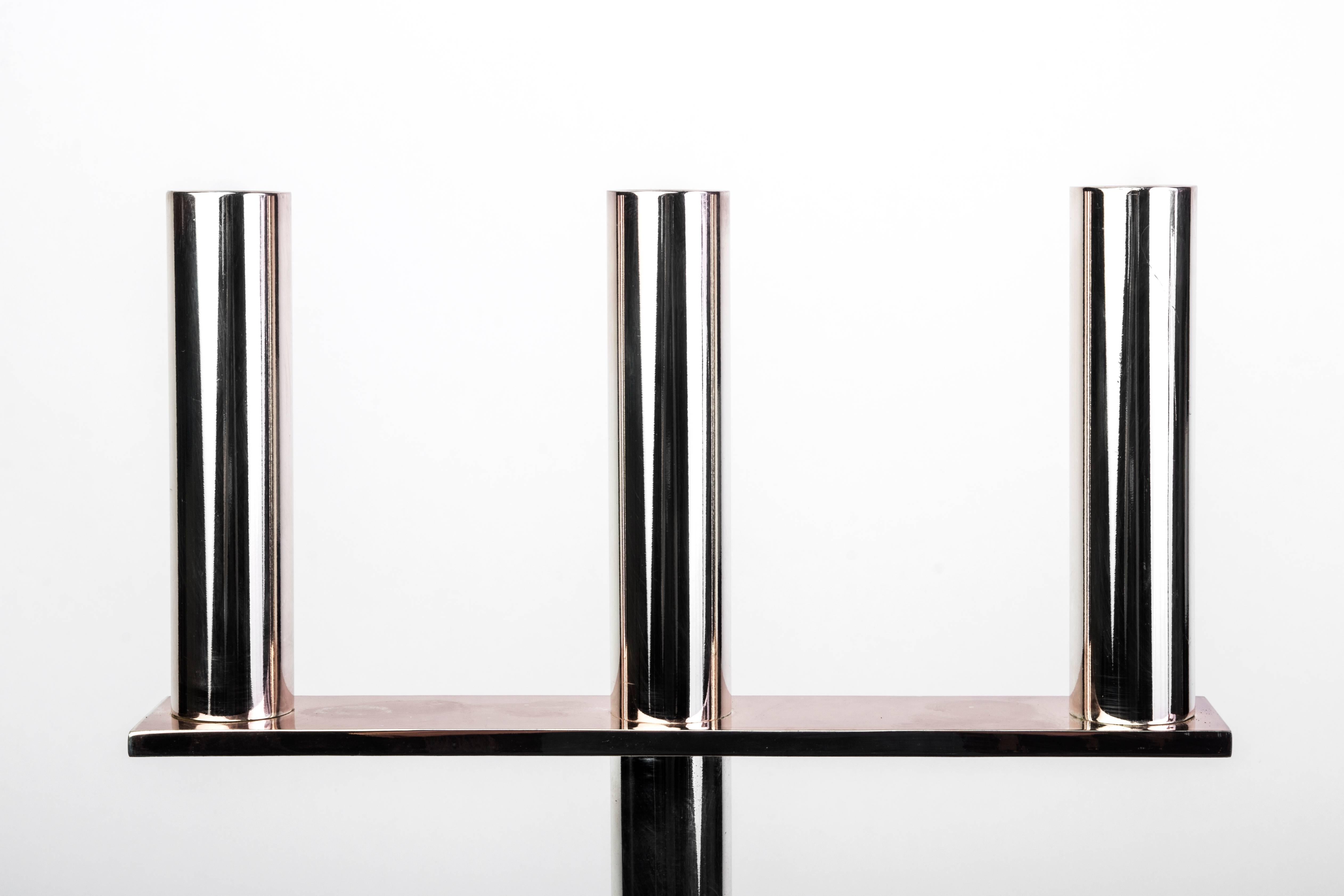 A very modern and geometrical in design (three) candles candlestick / candelabra / candleholder in silver plated and lacquered metal on the style of Hagenauer Wien. Marked FF.