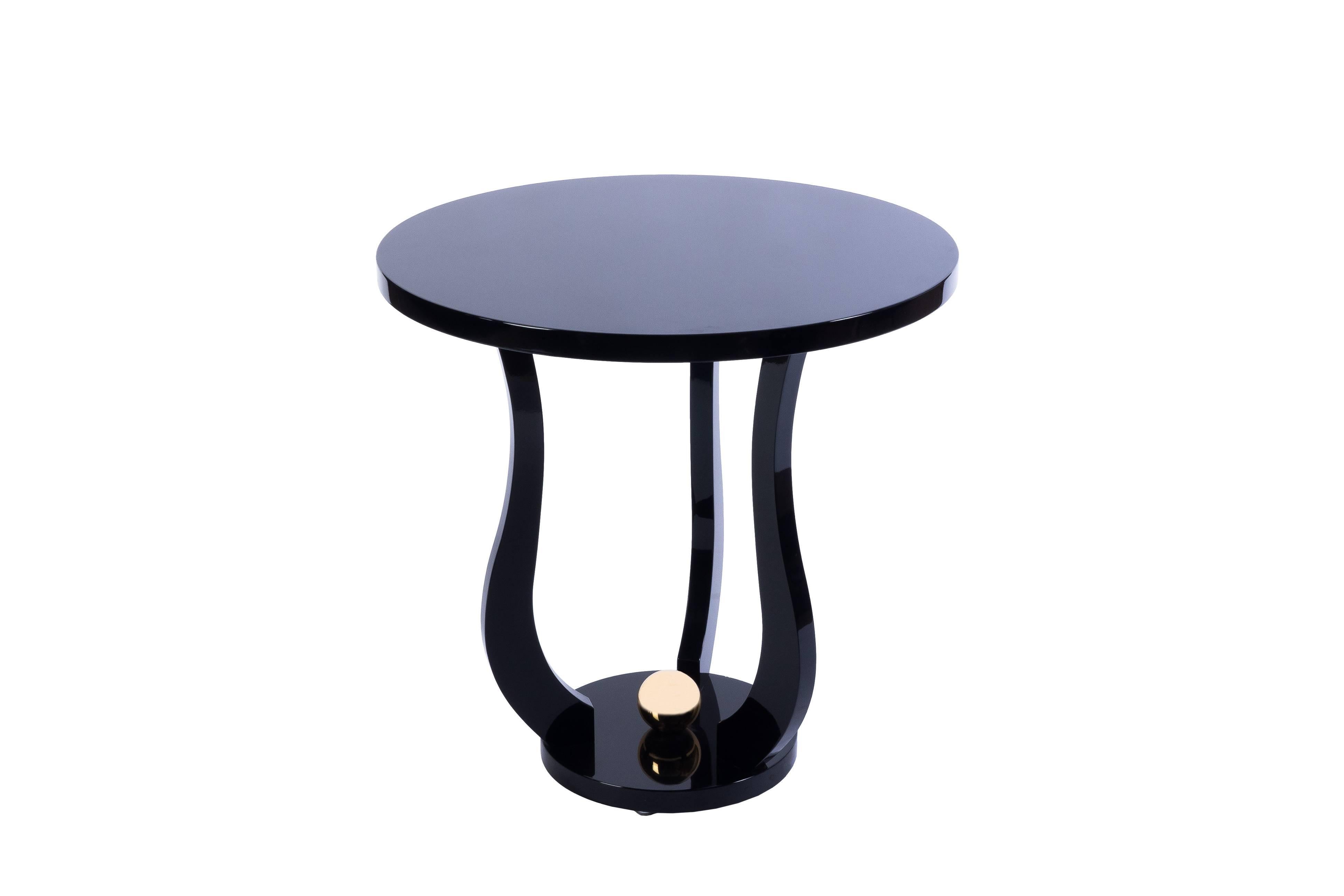 This gorgeous French Art Deco round side table features a tulip shape design in piano black lacquer with a decorative polished brass sphere on the base.
