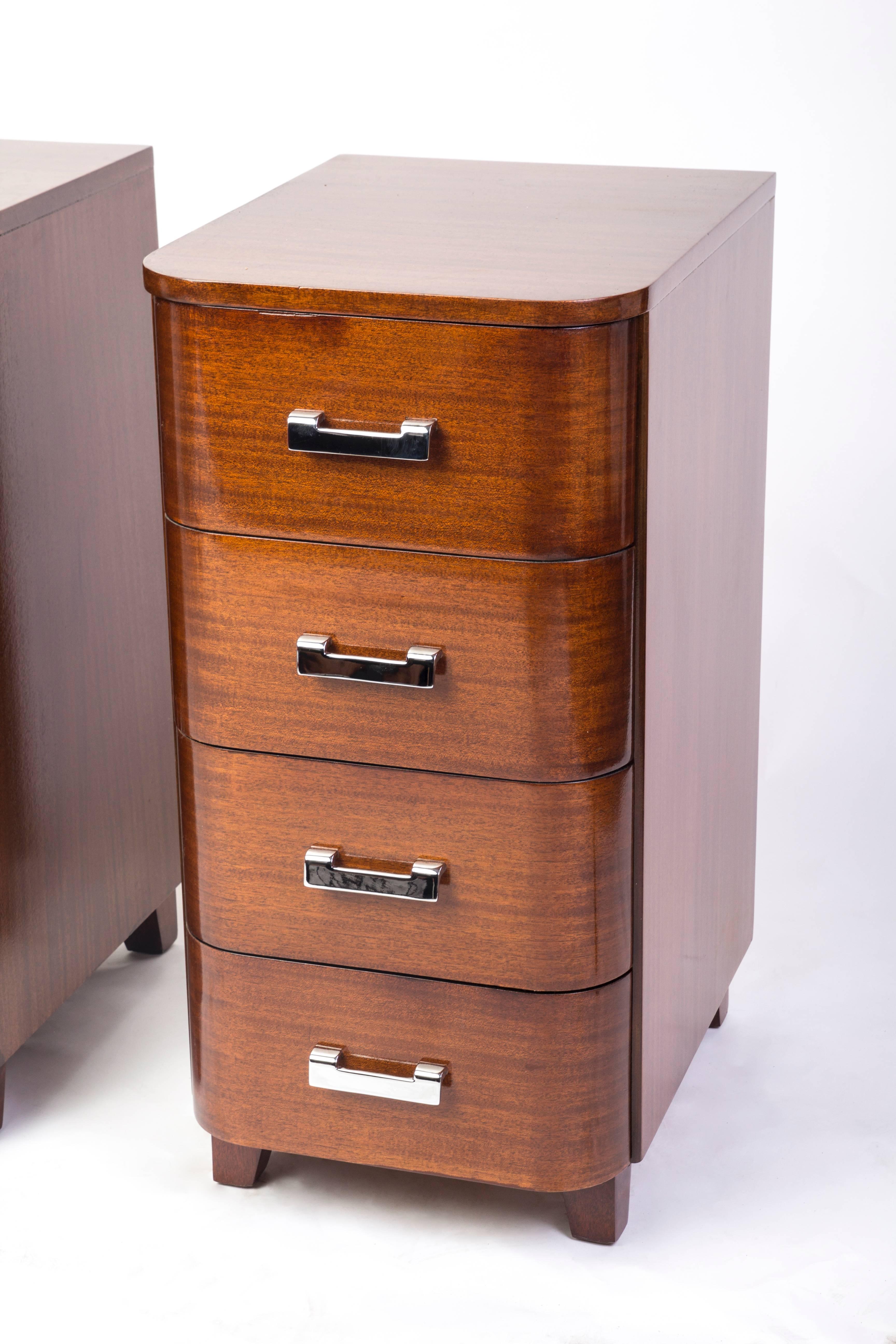 Pair of tall Art Deco streamline nightstands with four drawers in solid mahogany and nickel-plated metal hardware.