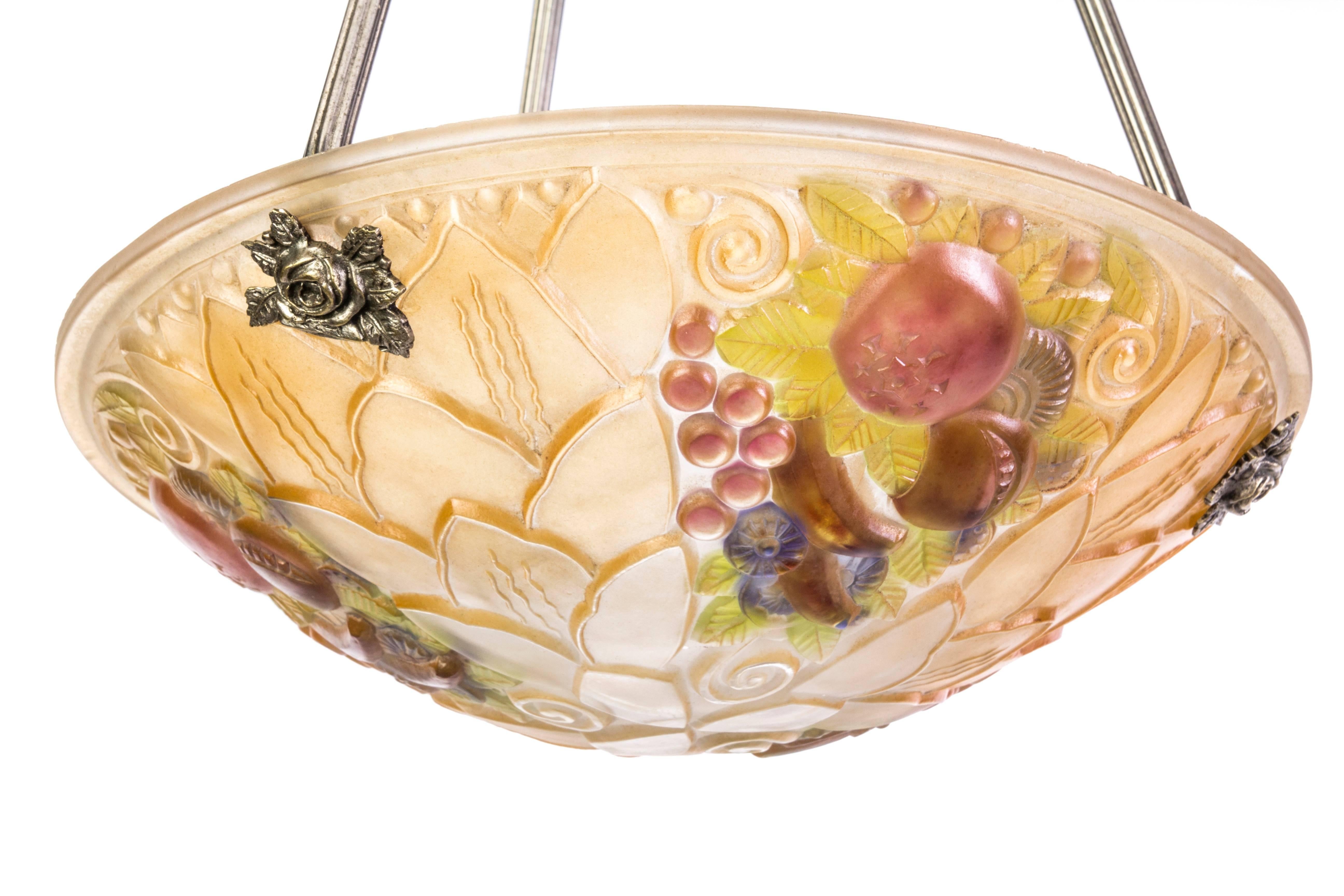 This wonderful early French Art Deco pendant features a gorgeous etched glass bowl with a fruit motif connected to a silver plated bronze frame.