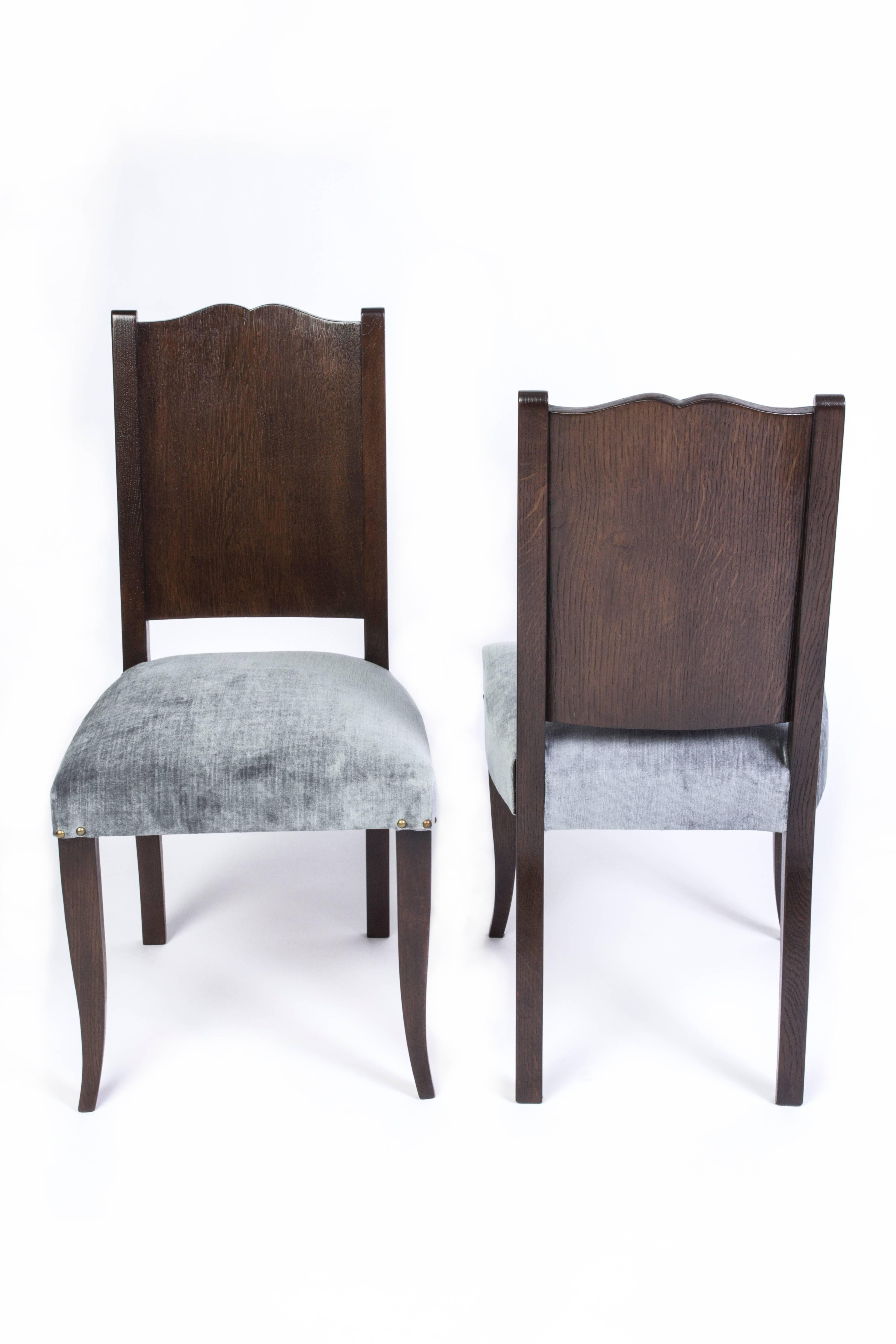 Stunning set of eight (8) French Art Deco dining chairs in stained Tiger Oak by Alfred Porteneuve.



  