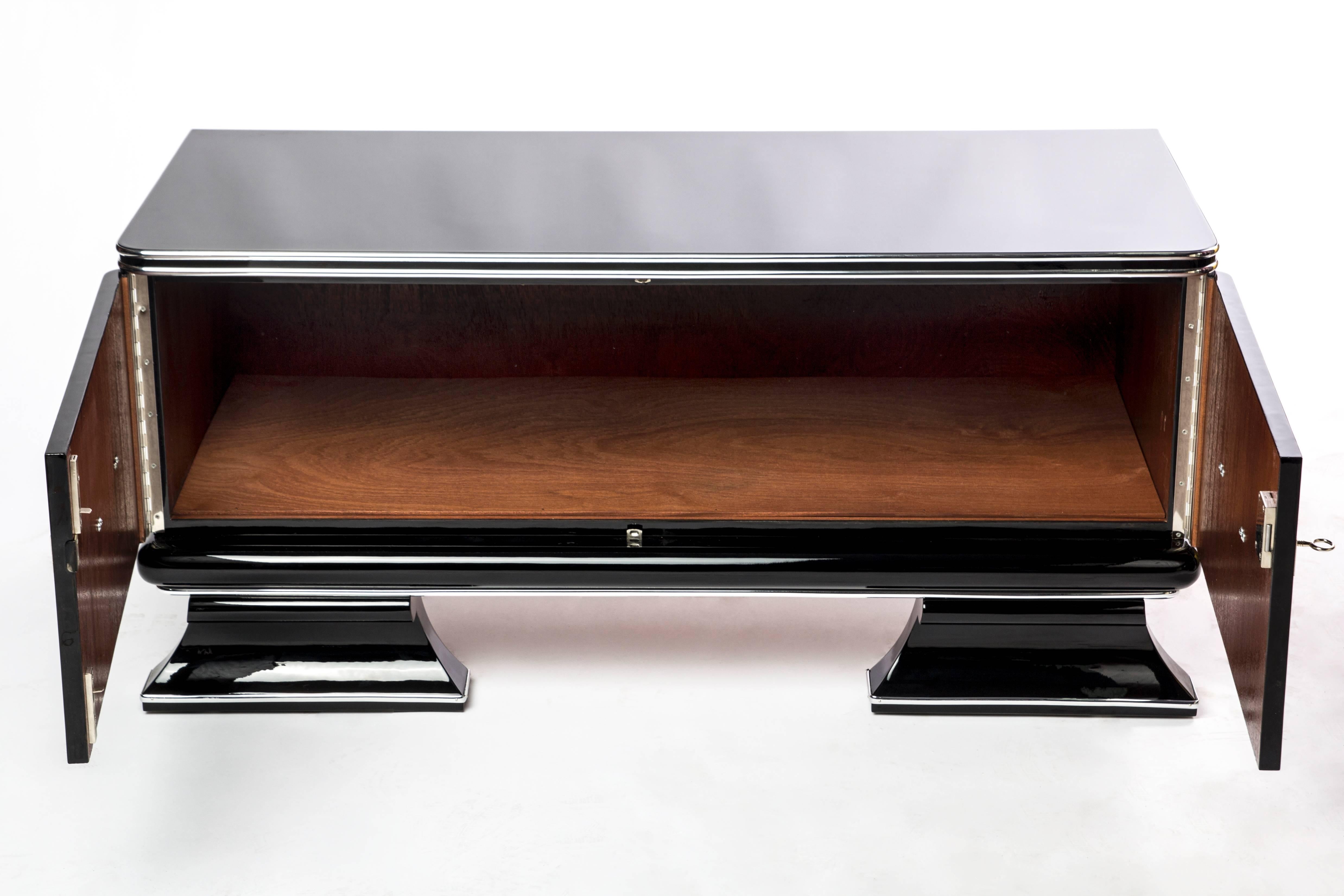 This superb Art Deco bar features a French foot base with chrome lines and fixtures finished in a high gloss black lacquer.