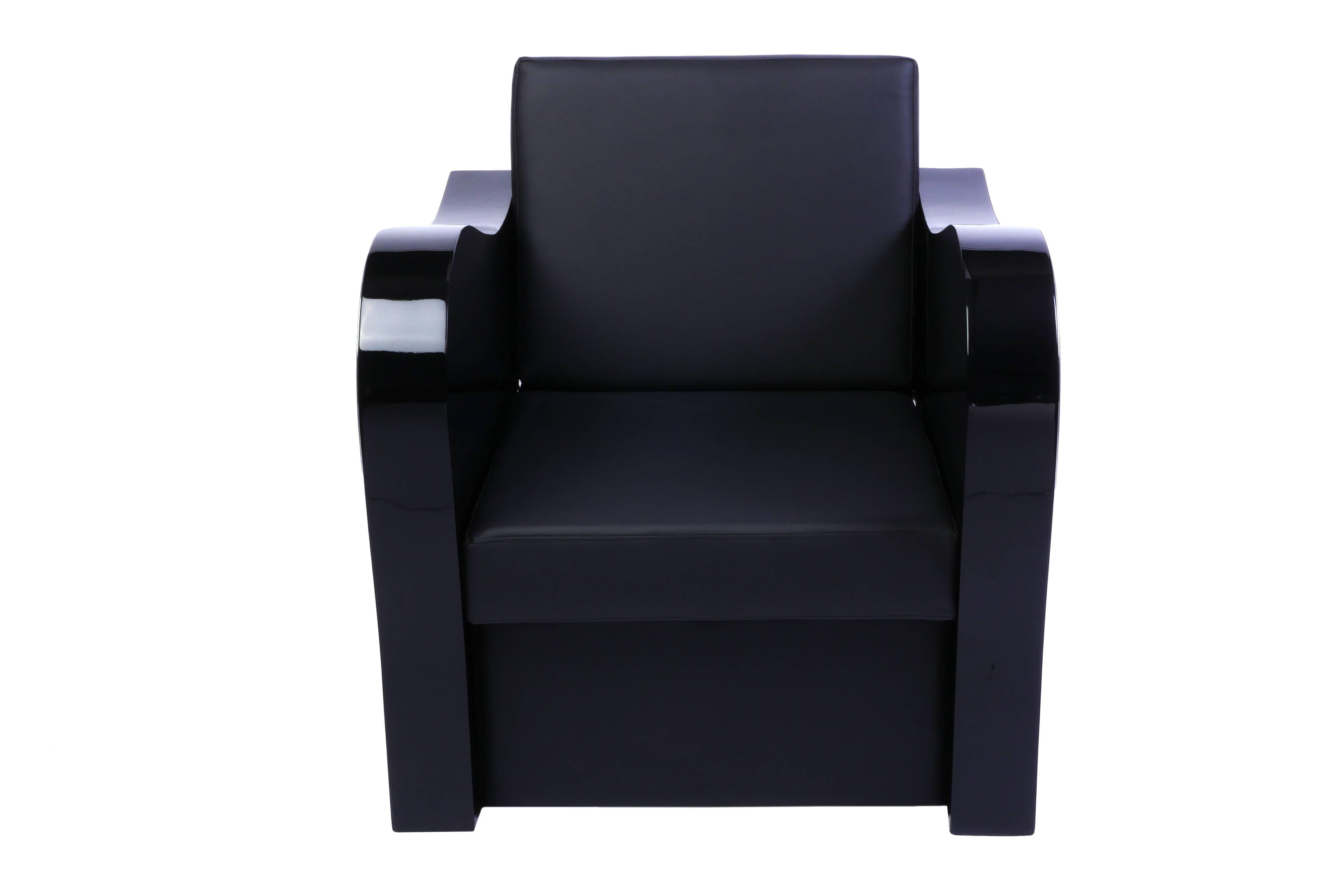 This chic Art Deco style armchair features chrome-line detailed swung armrests, with a beautiful black leather upholstery and finished in a high gloss black lacquer.

Two available.