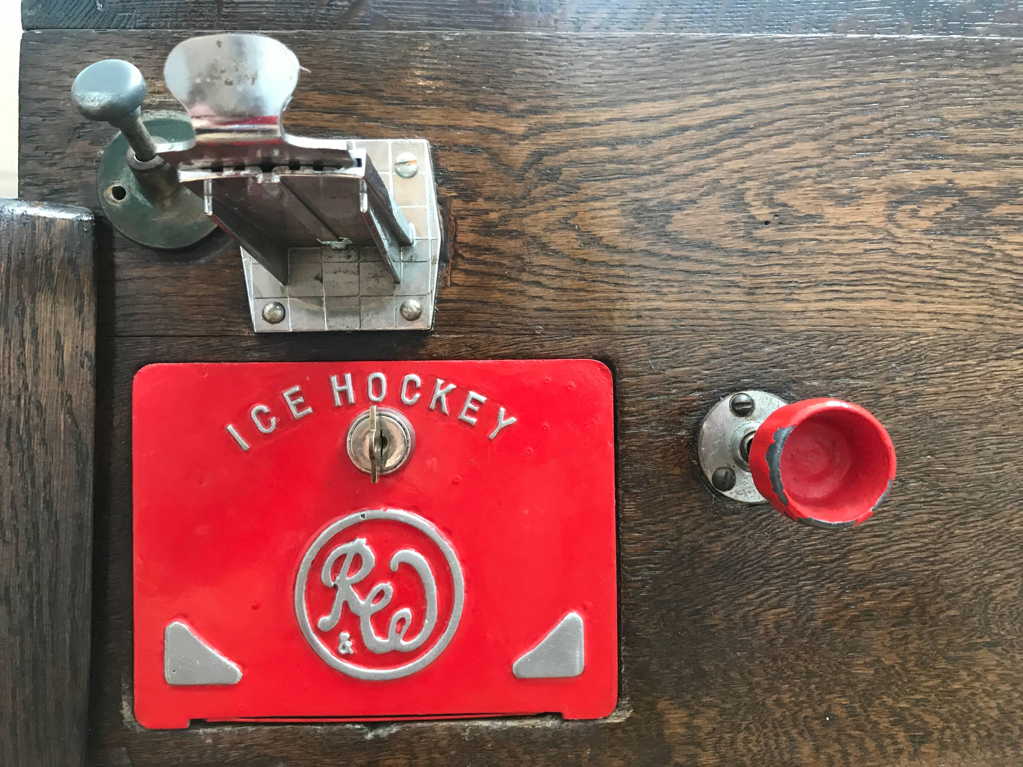 An incredibly sweet, vintage Ice Hockey Game by Ruffler & Walker of London UK from the 1950s manufactured in solid oak. 

This is a real find and incredibly rare to find an item like this in such good condition other than in a museum. All parts
