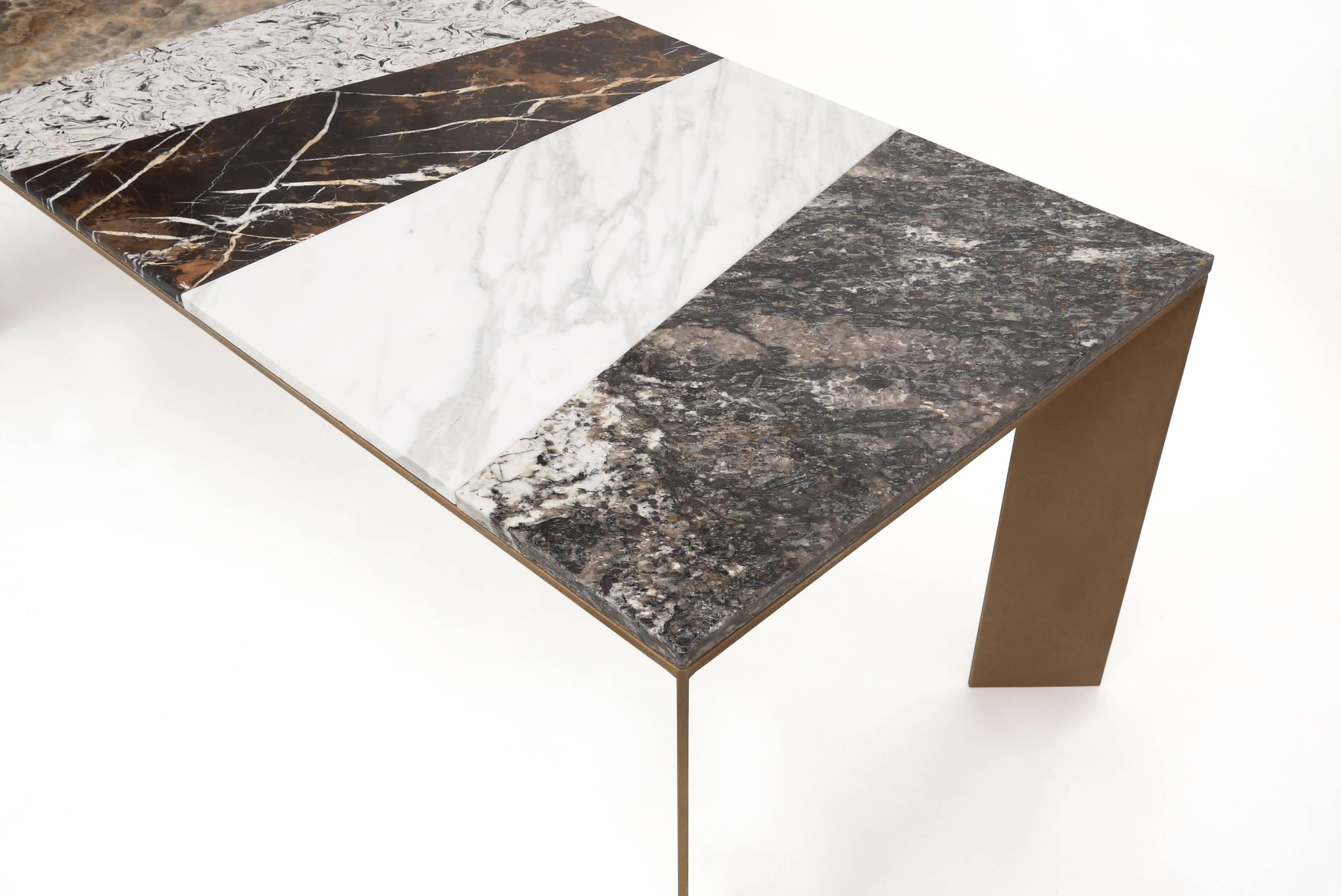 Dining table rendered in a mixture of reclaimed marble, quartz and granite on a textured bronze-coated aluminium base. Available in a range of sprayed metallic coatings including bronze, copper and zinc. 

Suitable for outdoor applications.