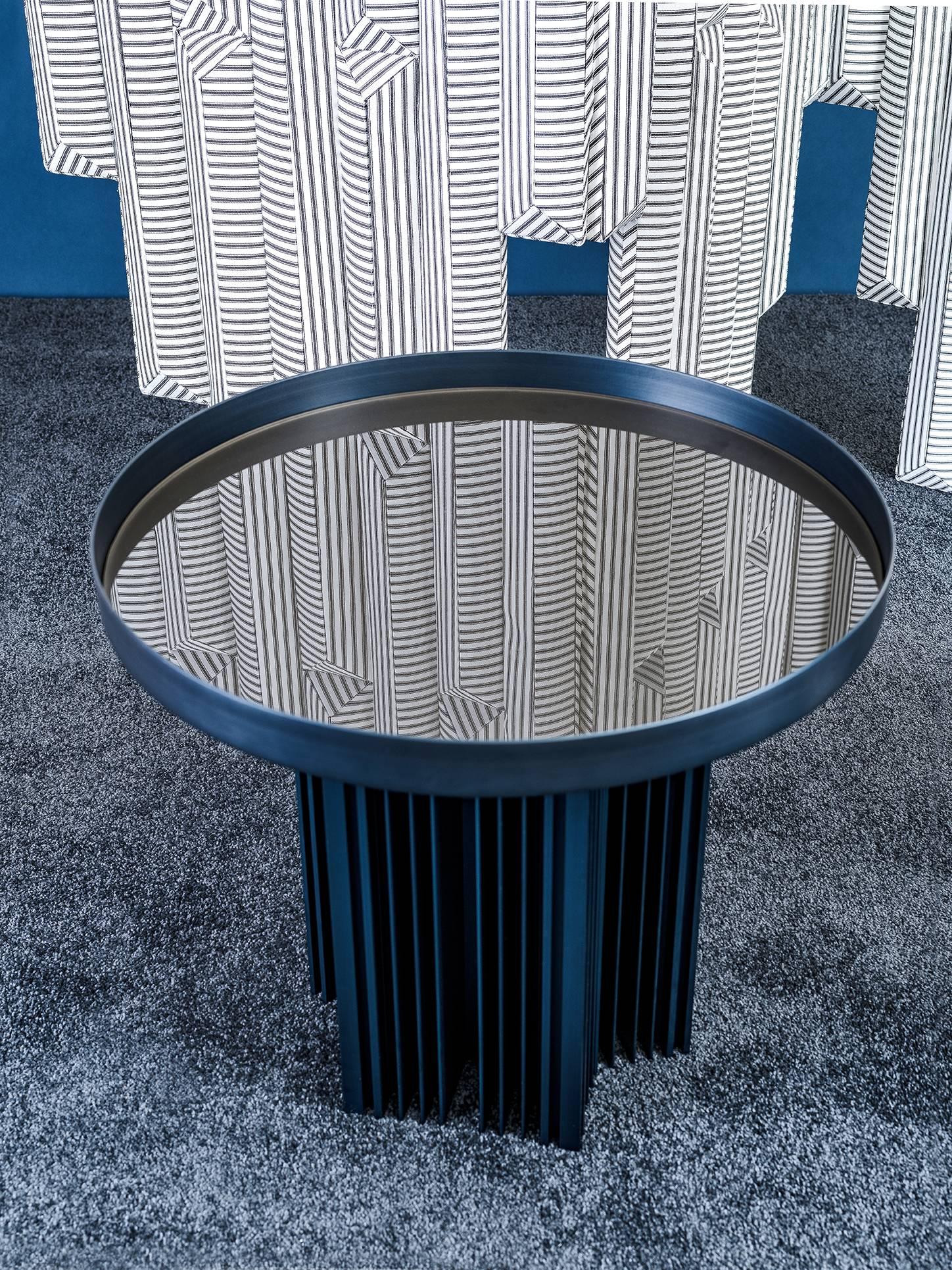 Side table in spun and extruded anodized aluminium. Inset glass top. Suitable for outdoor applications.