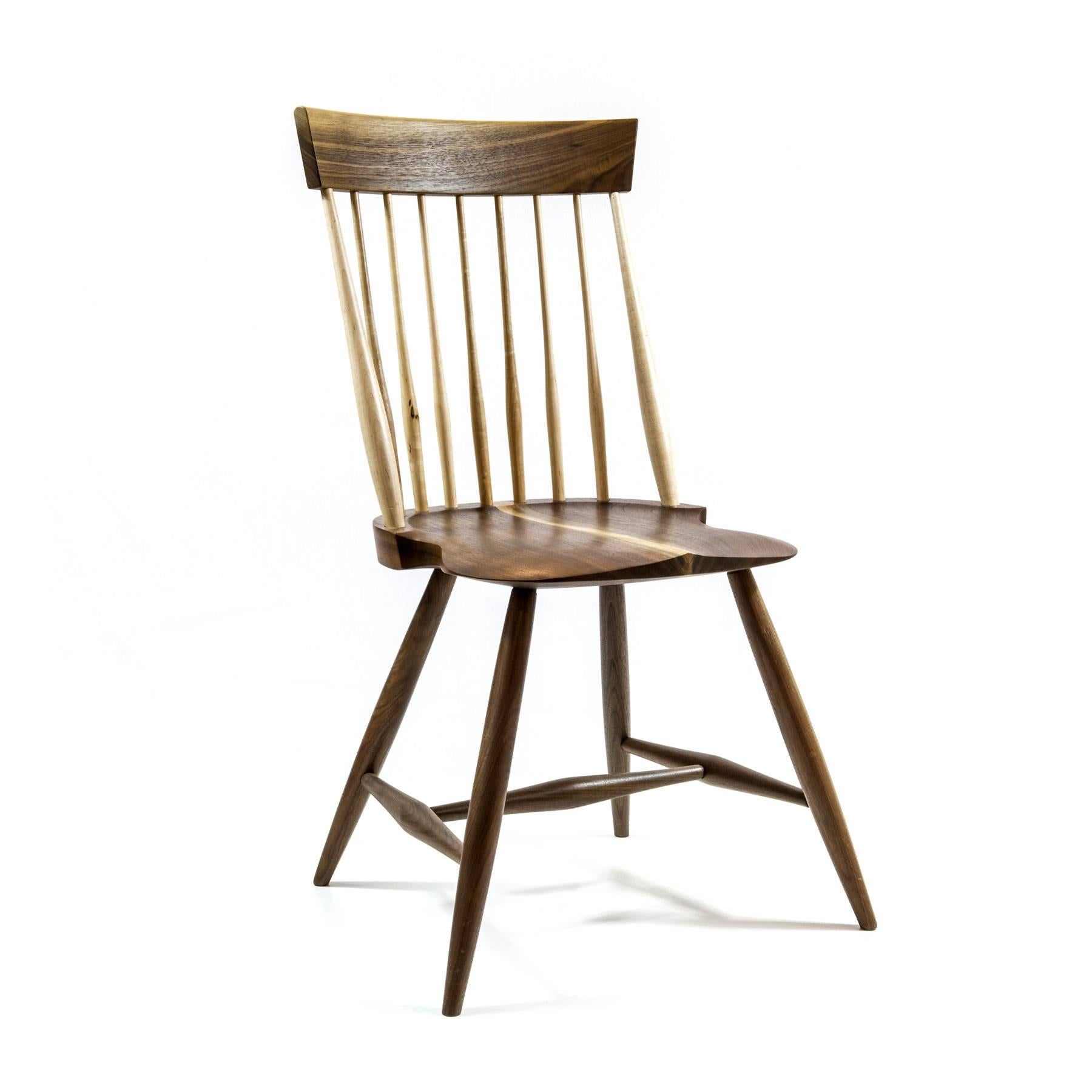 Walnut version of a simplified traditional American chair with maple back slats. A minimal take on the classic. Available as a side chair or a captain's chair. Handmade in Pennsylvania.

Designed by our sister brand Shimna.