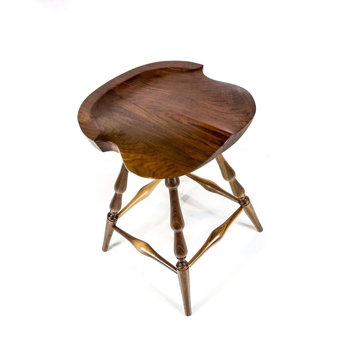 The Brubaker stool is a swivel barstool inspired by our windsor chairs and antique tractor seats. Built from solid black walnut, the stool is about 25" tall, and seat is 17.5 inches.

Designed by our sister brand Shimna. Additional discounts