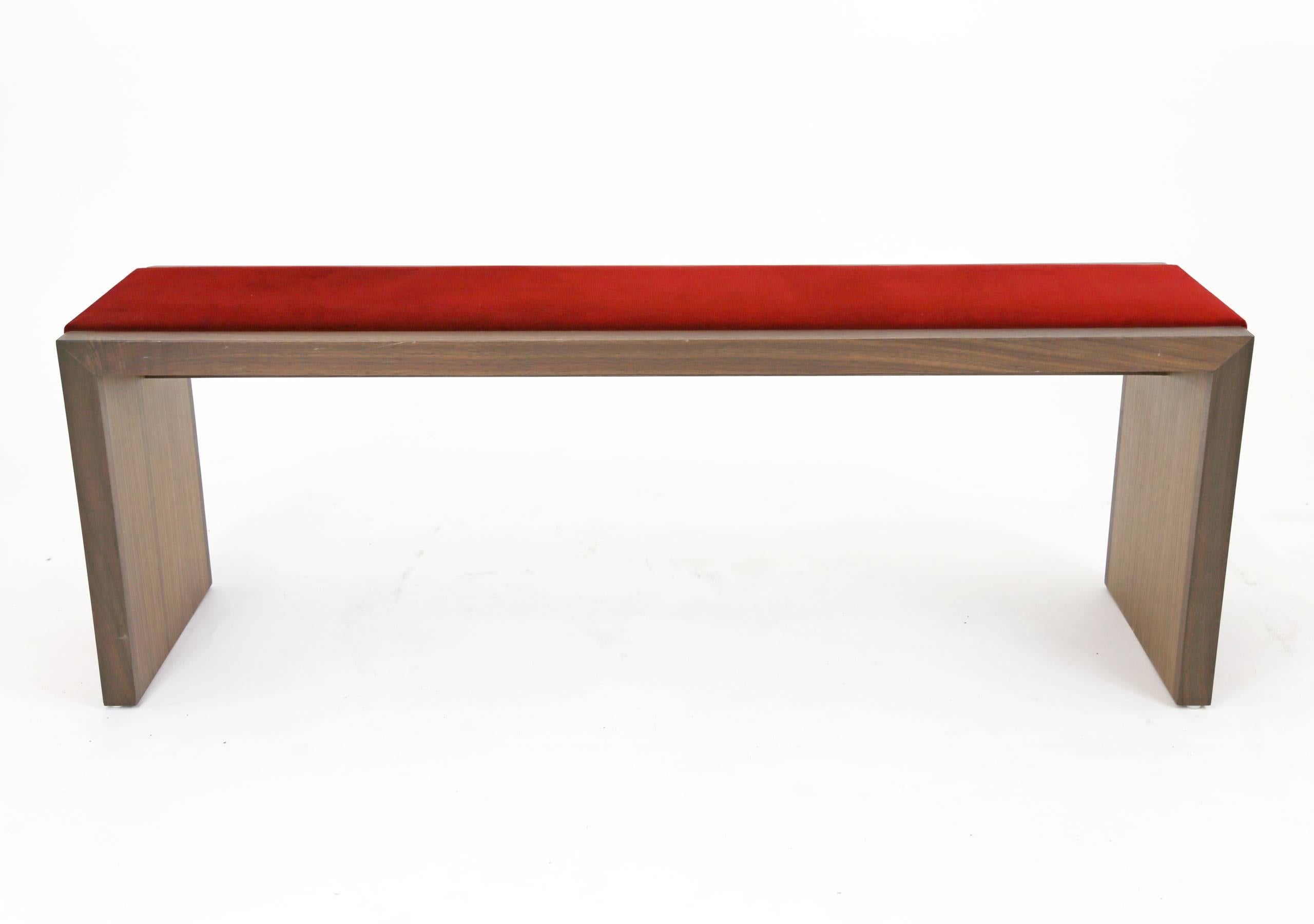 Walnut bench with a red velvet strip running across the seat and down both legs for a luxurious and interesting touch. 

Floor model made in Brooklyn by Sentient, in like new condition.

Dimensions 48ʺ W × 14.0ʺ D × 18.0ʺ H.