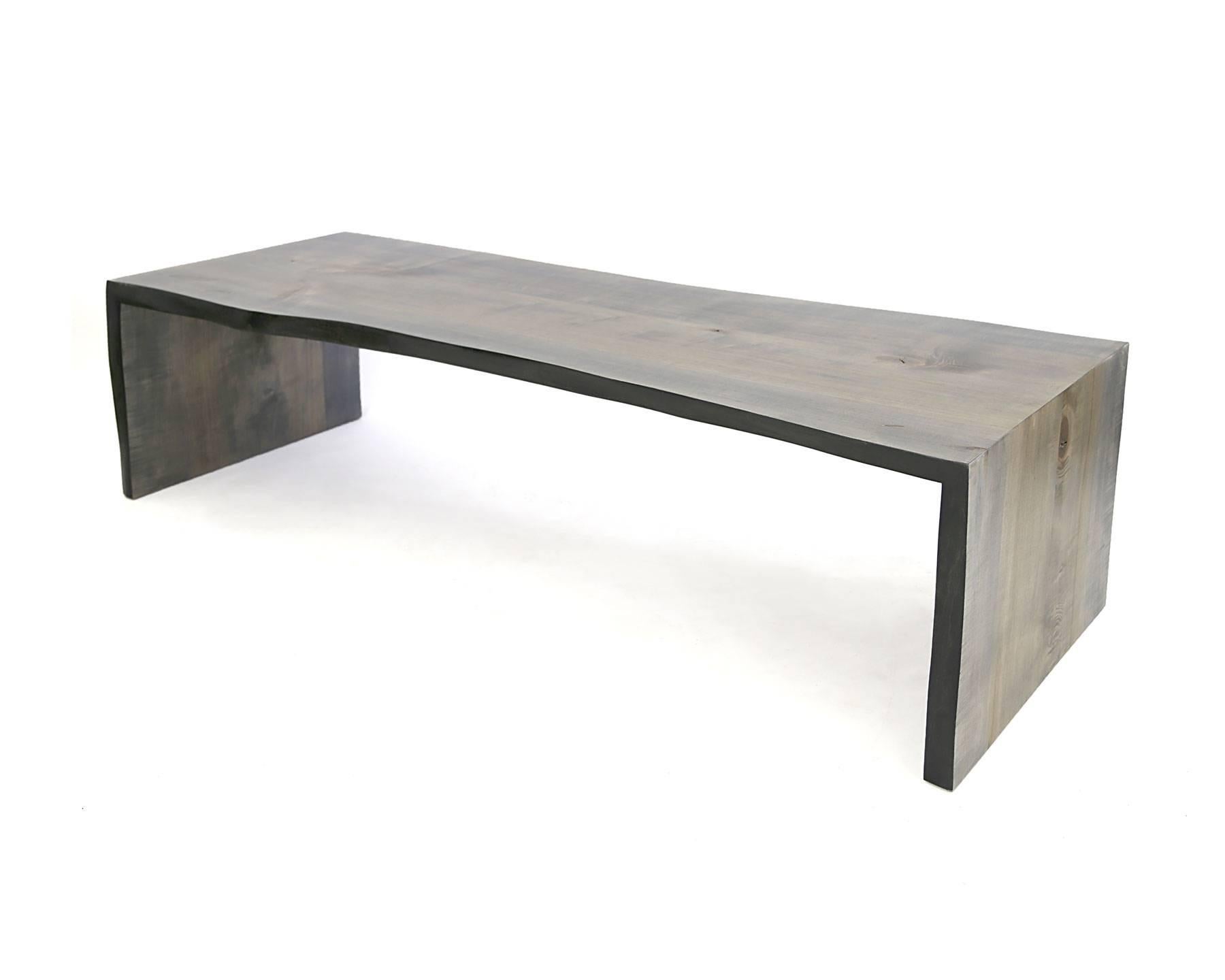 A relatively large coffee table with our custom driftwood finish on a maple live edge slab. The 