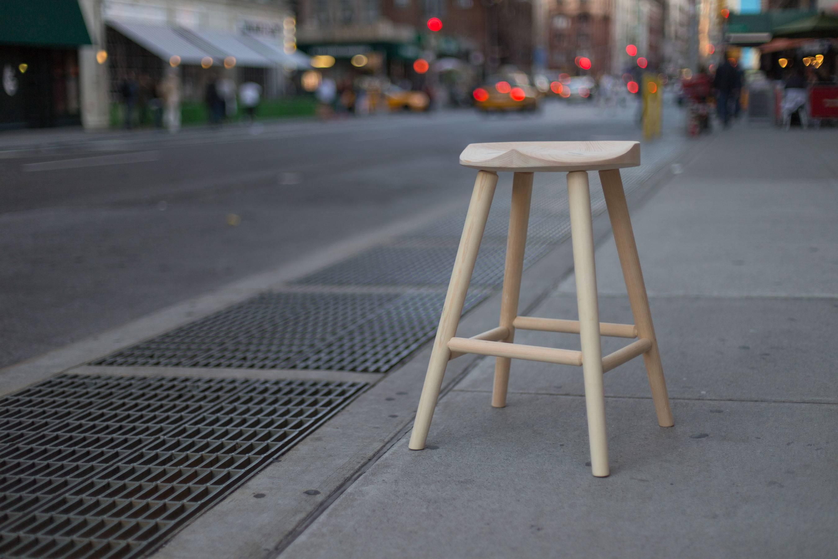This simple barstool is quite comfortable, and the hand-carved seat keeps you in place for saddling up to the bar for the long haul. Shown in natural maple, but other options including lacquered colors, walnut and other hardwoods are also available.