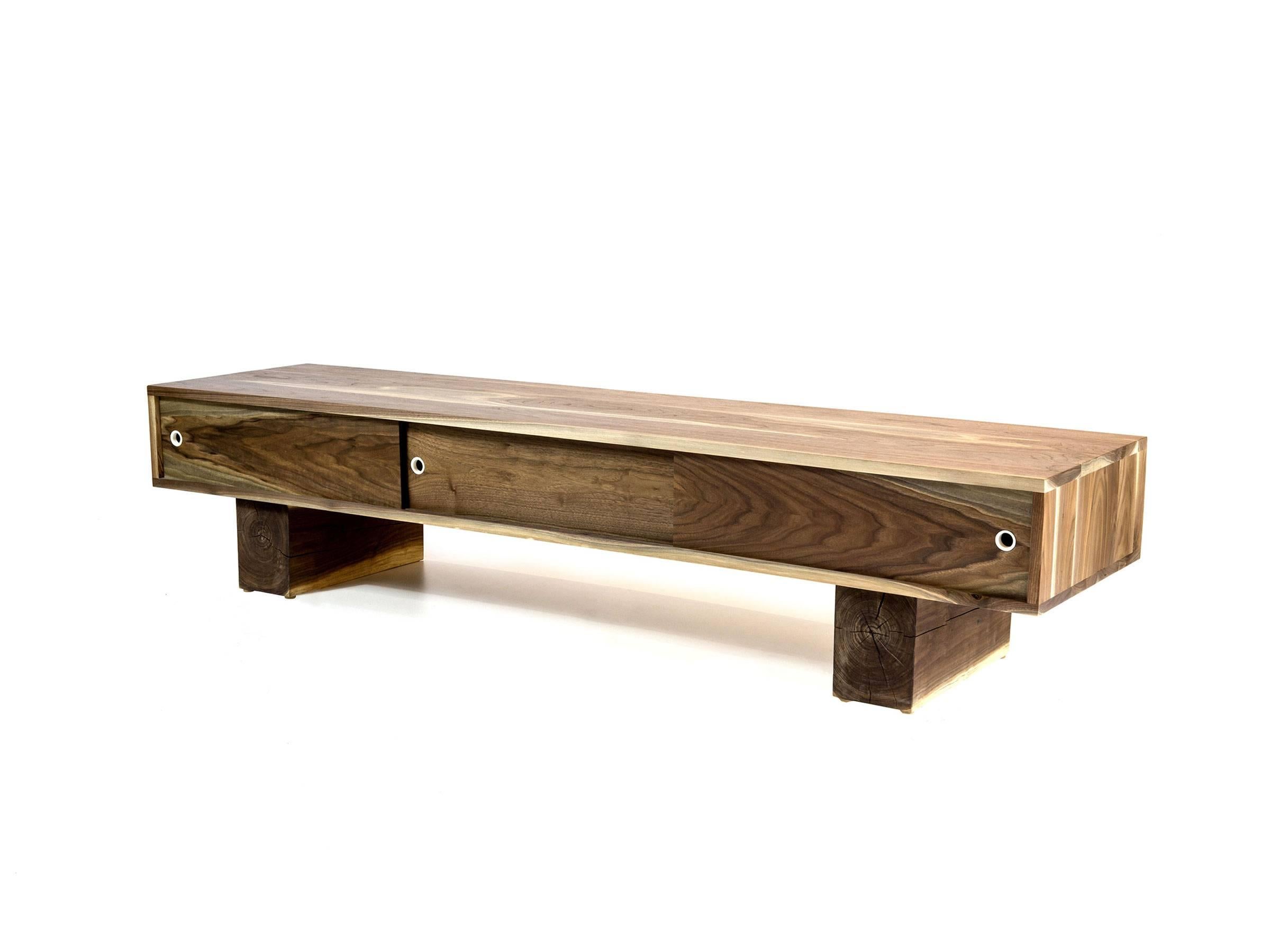 Low flung media console with three sliding doors. Sitting on scaled down beam legs, the Pawnee is perfect for media devices such as TVs, turntables, speakers, etc. This console helps to hide the clutter that comes with these electronic