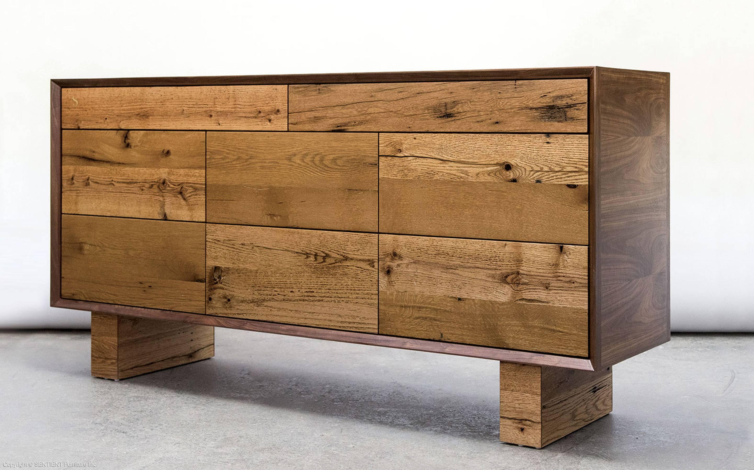 The sentient new old dresser is a grand juxtaposition between refined American black walnut and reclaimed oak from a barn in Pennsylvania. The result is a statement piece that can anchor a room or hallway. It operates as a very simple design, but