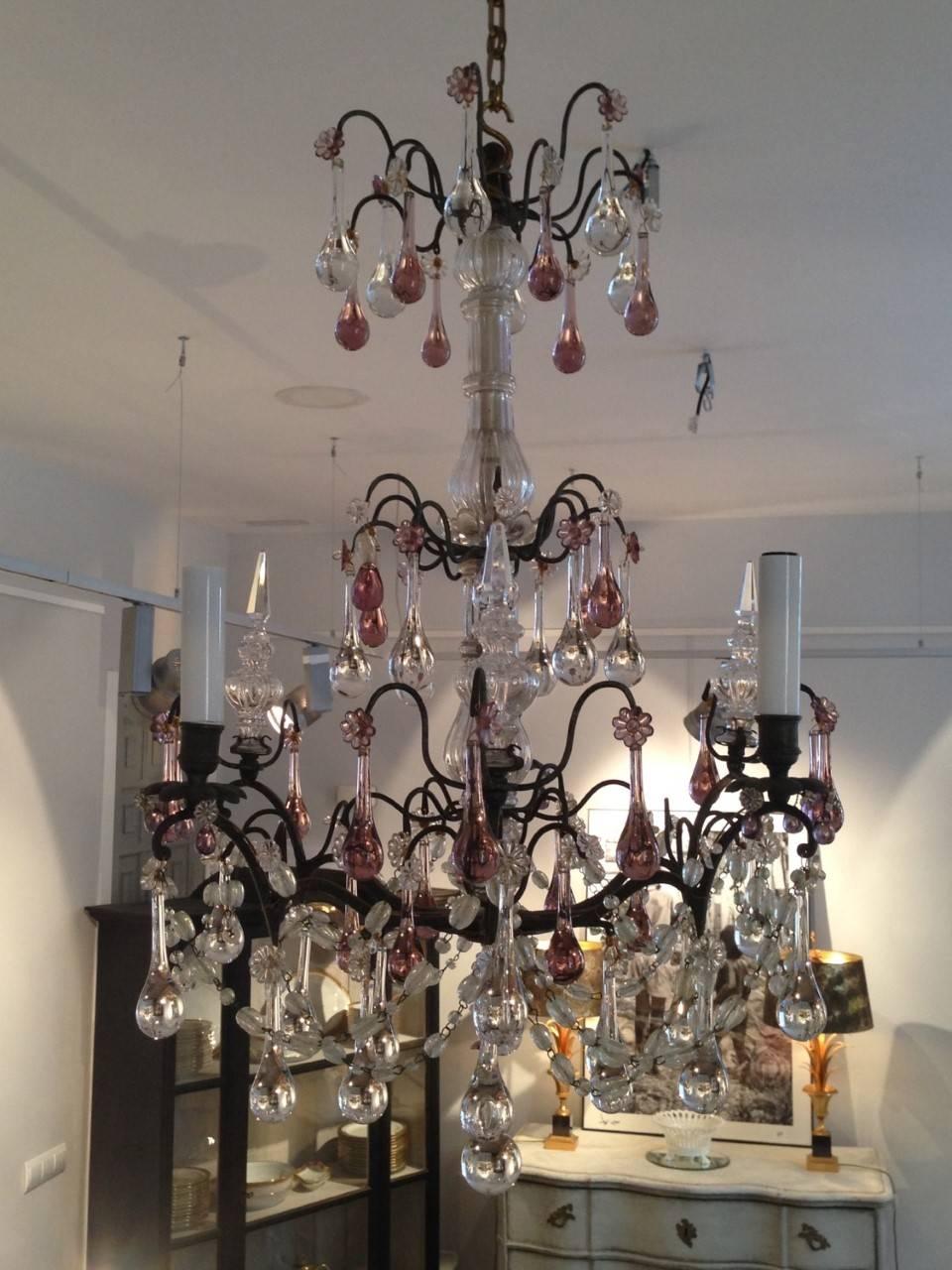 A French Baccarat chandelier of six branches, three lights and three spires to reflect the light- with amethyst and clear glass drops, from the end of the, 19th century. Re-wired.
 