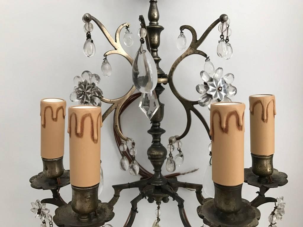 Rare antique pair of French four arms silver bronze wall lights decorated with crystal pendants, from the beginning of the 19th century.
Restored and fully rewired.
