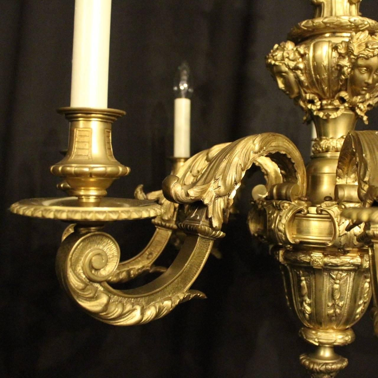 A quality French gilded bronze eight-light antique Mazarin chandelier, the decoratively clad acanthus leaf square gauge scrolling arms with circular sectional bobeche drip pans and bulbous candle sconces, issuing from an ornate leaf central column