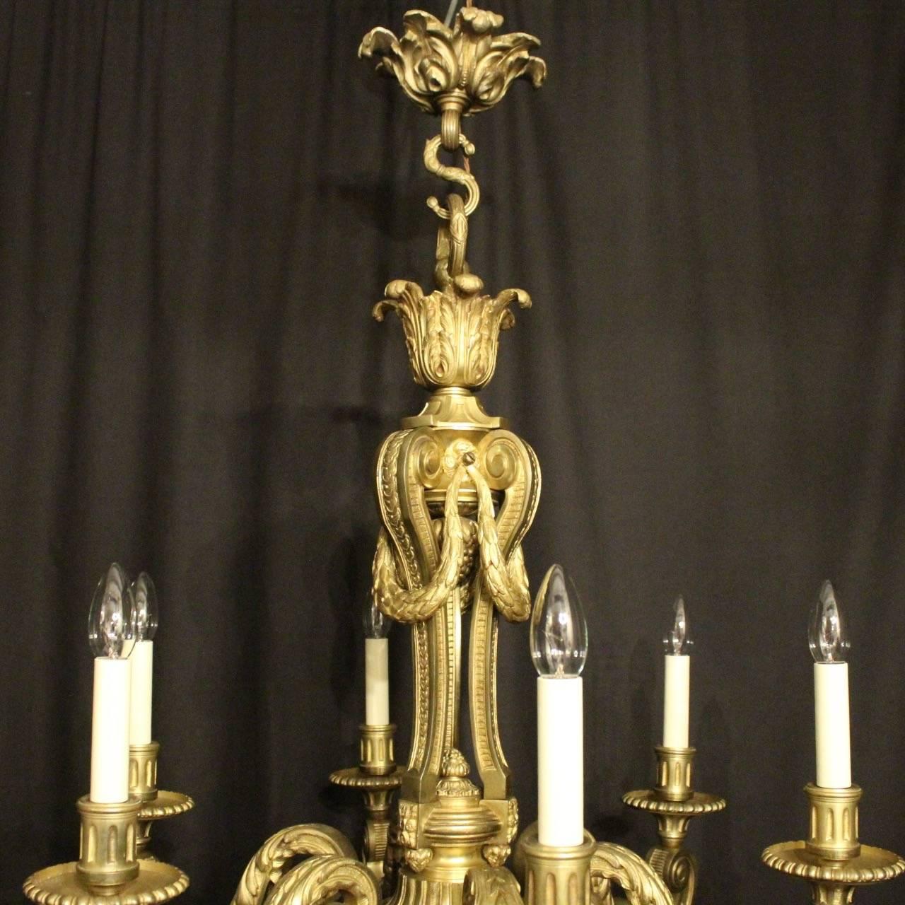 A quality French gilded bronze six-light Mazarin antique chandelier, the decoratively clad acanthus leaf square gauge scrolling arms with circular trumpet reeded bobeches drip pans and reeded candle sconces, issuing from an ornate triple sectional