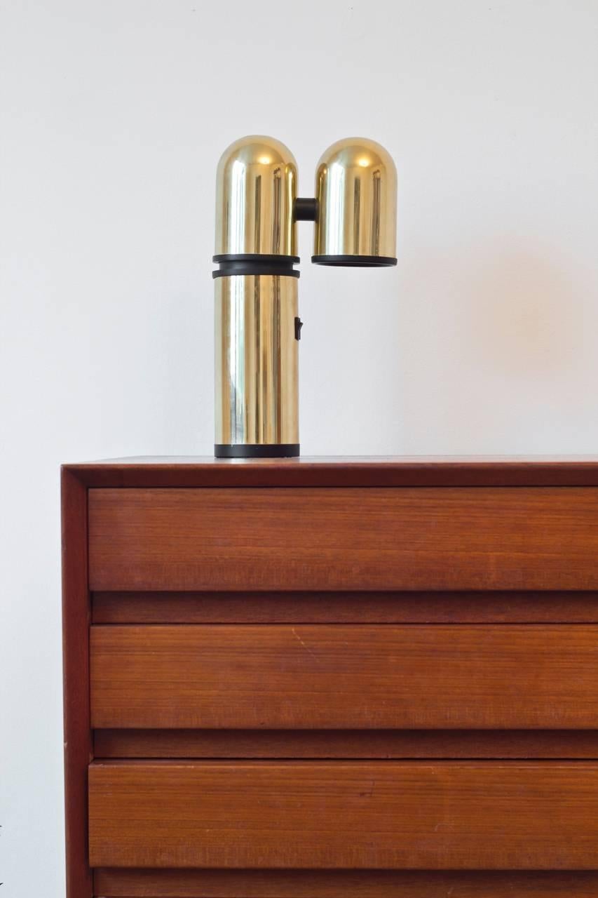 Polished brass table light produced by Swedish company Fagerhults. The lamp incorporates two independent axis that swivels 360° without the base of the lamp being moved. Designed in the 1960s. Perfect working condition. New electricity.
