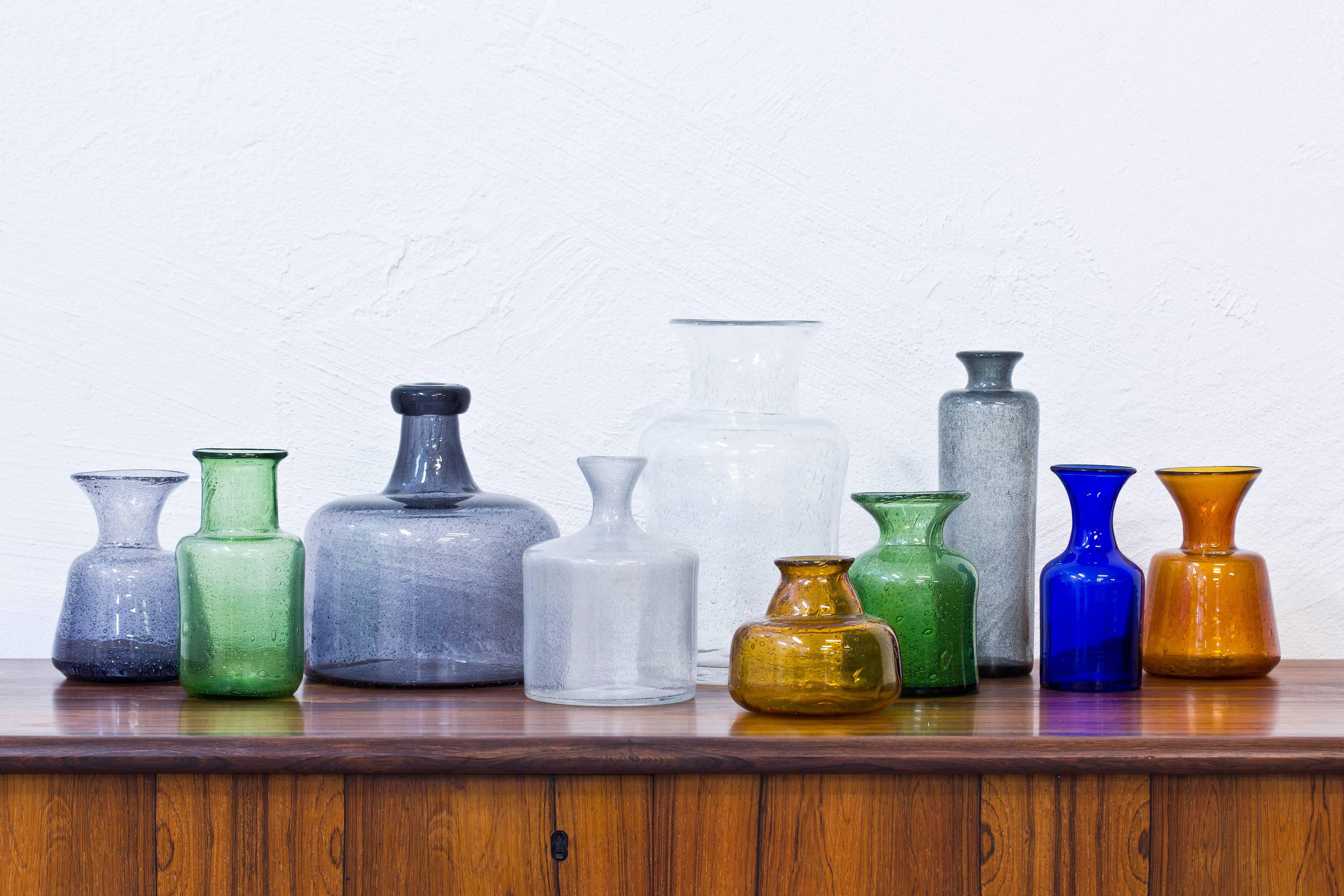 Collection of ten glass vases designed by Erik Hoglund. handblown at Boda glass hut during the 1950s. Ten different sizes, colors and shapes in very good to excellent condition. 

Price for the collection.