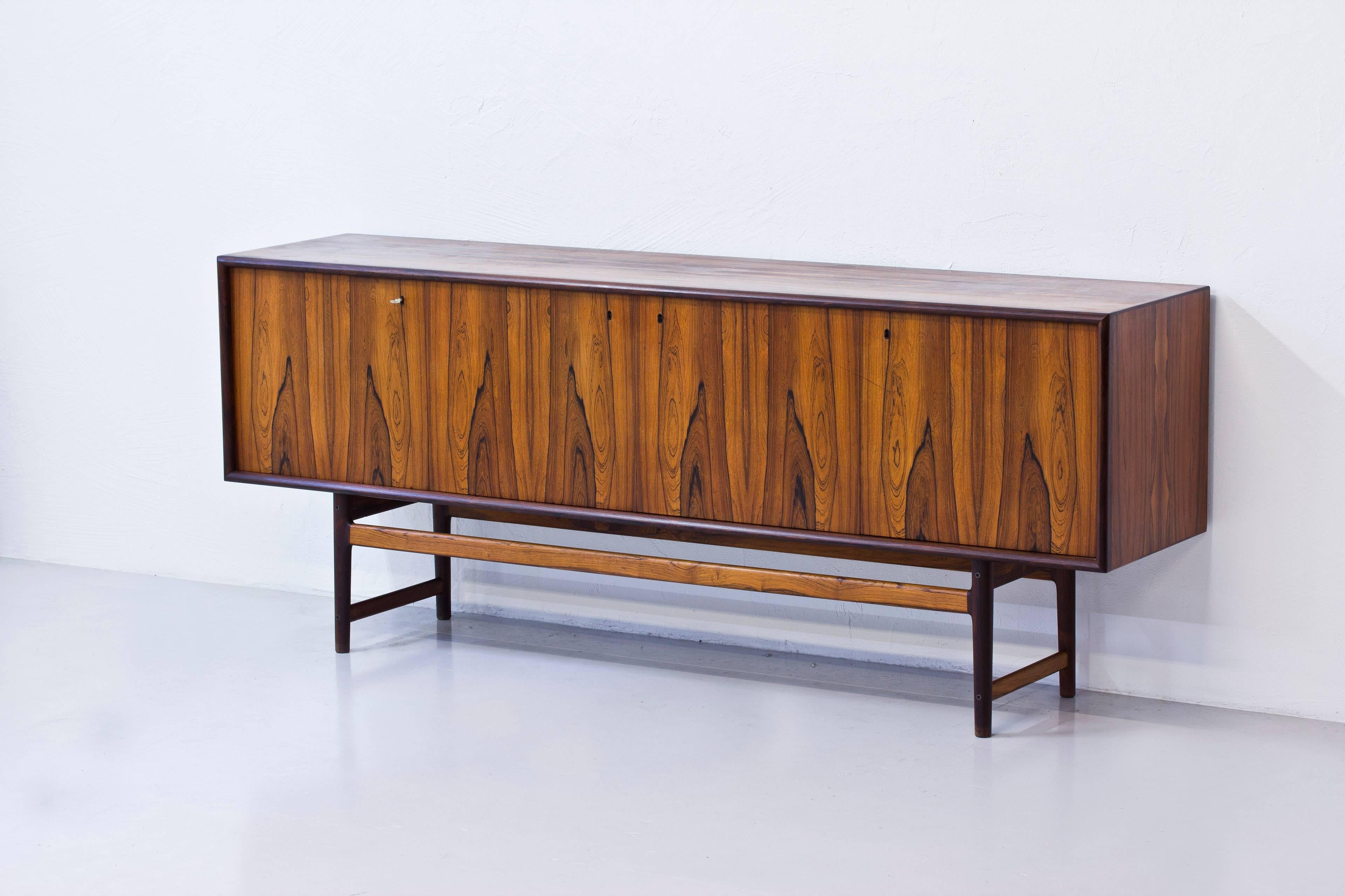 Sideboard model Darby designed by Torbjorn Afdal. Produced in Norway during the late 1950s by Nejestranda Moblefabrik for Bruksbo. Made in palisander wood. Solid palisander in the legs and the drawers. Very high quality piece with lovely crafts