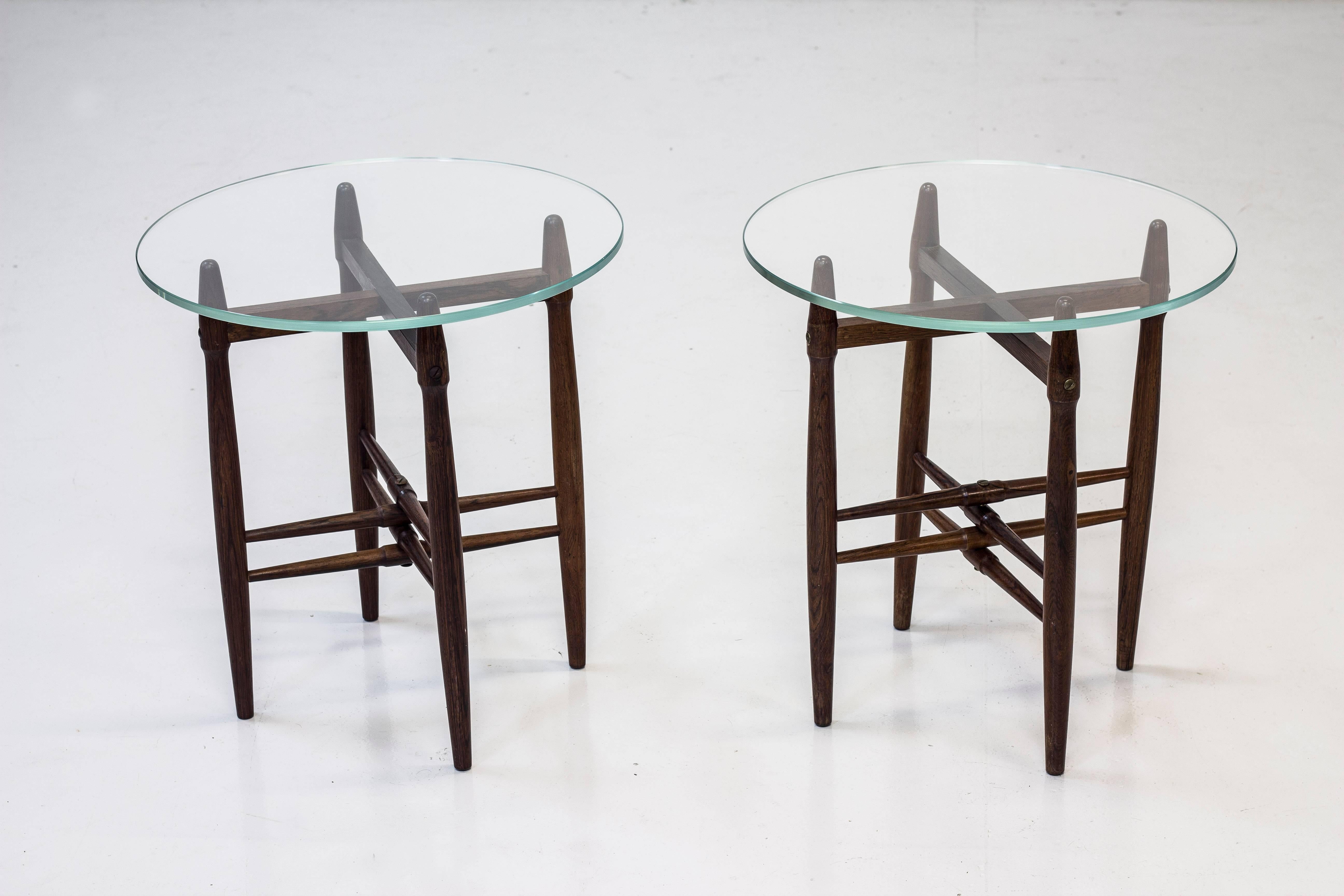 Pair of side tables designed by Poul Hundevad. Produced in Denmark during the 1950s by Vamdrup. Solid palisander table stands with thick round glass table tops. Excellent vintage condition with few signs of wear and very light age related