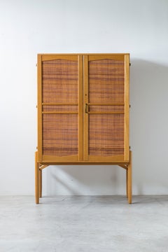 Cabinet with cane and green lacquer inside by Svante Skogh and Seffle möbler