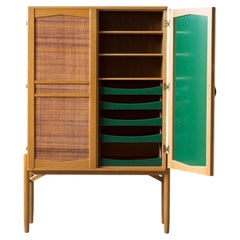 Cabinet with cane and green lacquer inside by Svante Skogh and Seffle möbler