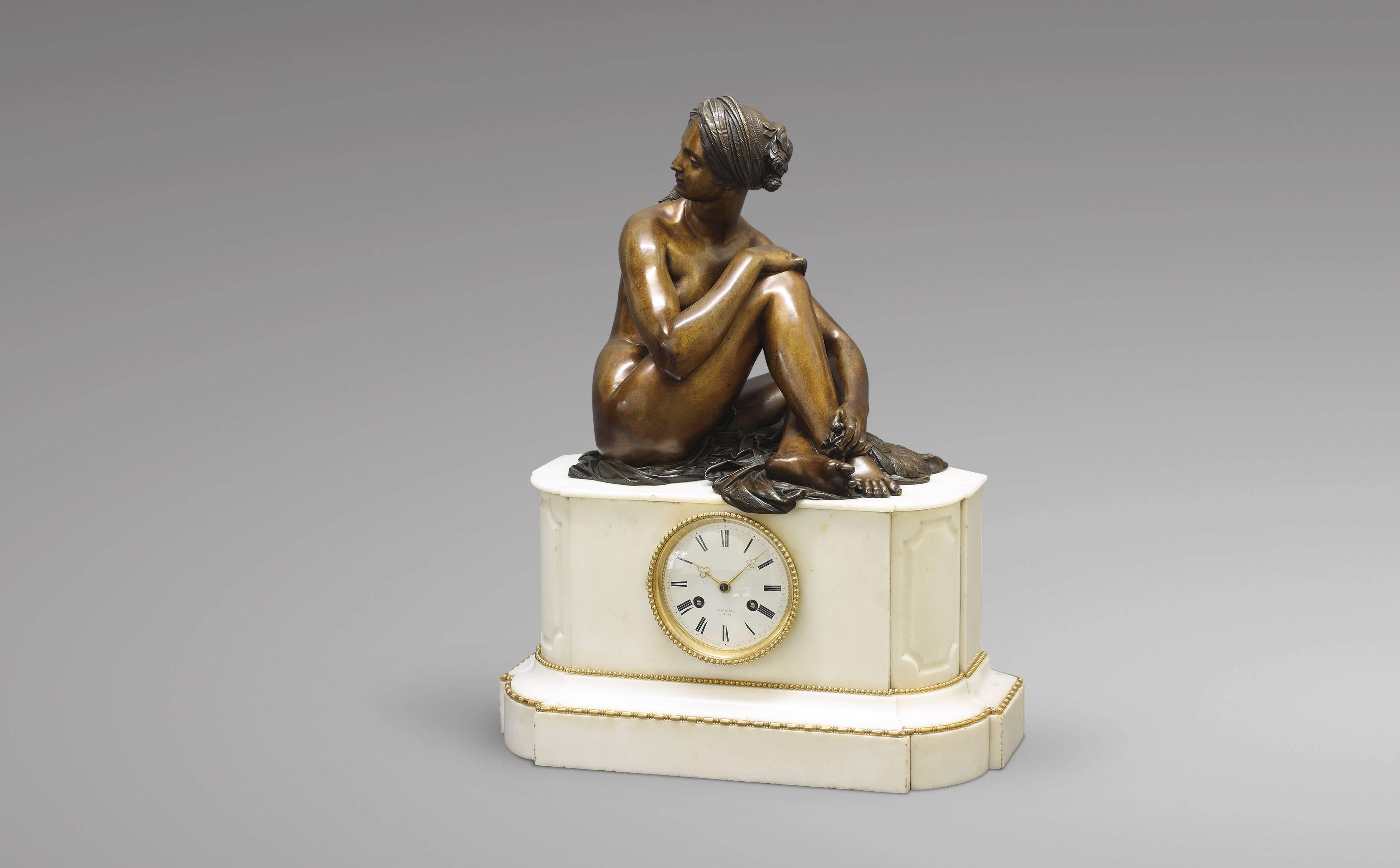 White marble and patinated bronze mantel clock, signed MAZILIER à Metz with the bronze statue of an 
