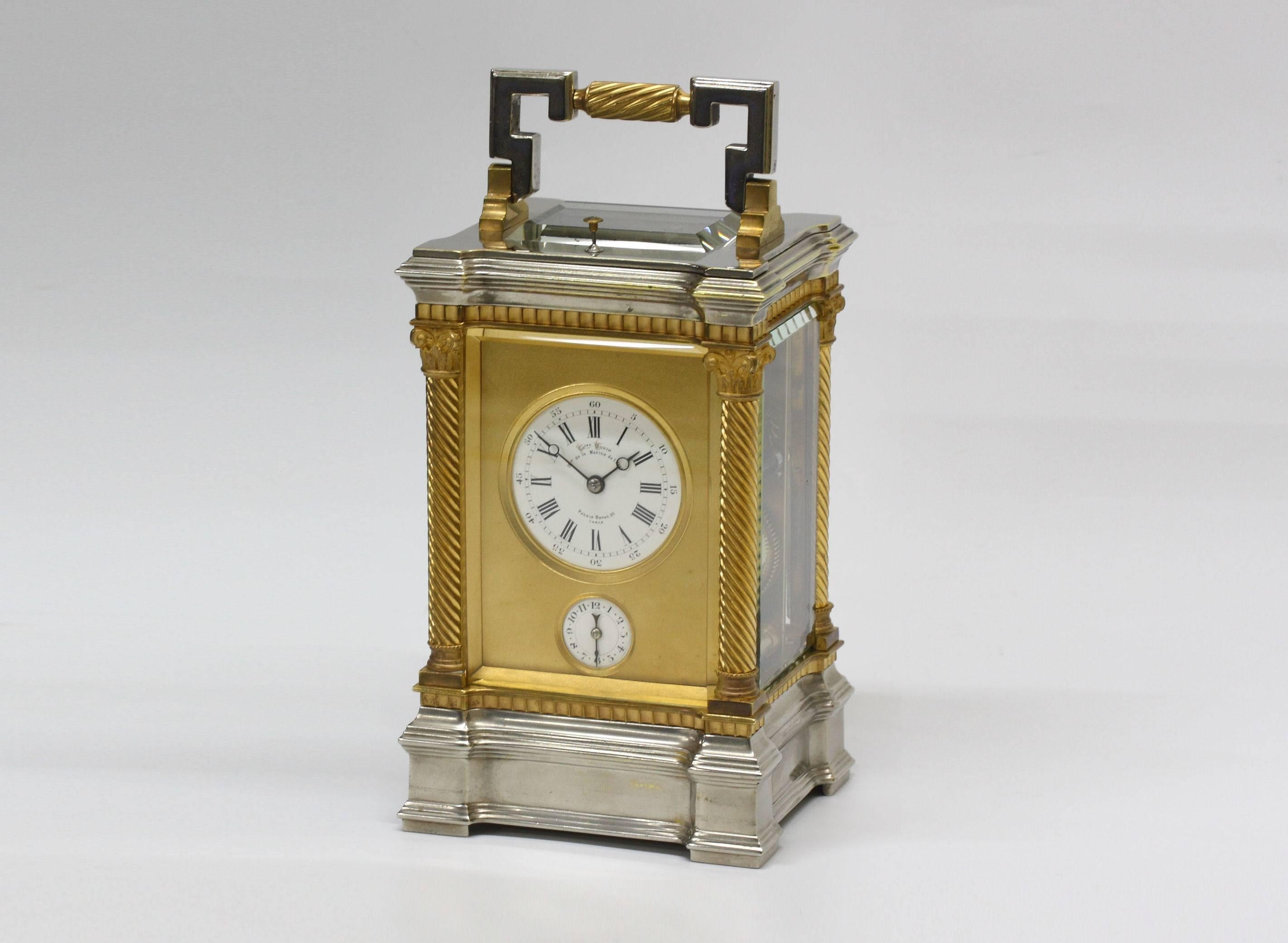 Charles Oudin, carriage clock and original leather case, with alarum and half-hourly strike, ormolu and nickeled bronze case, second half of 19th century.

Signed on the dial: Chles Oudin, Hger de la Marine de l’Etat, Palais-Royal, 52,