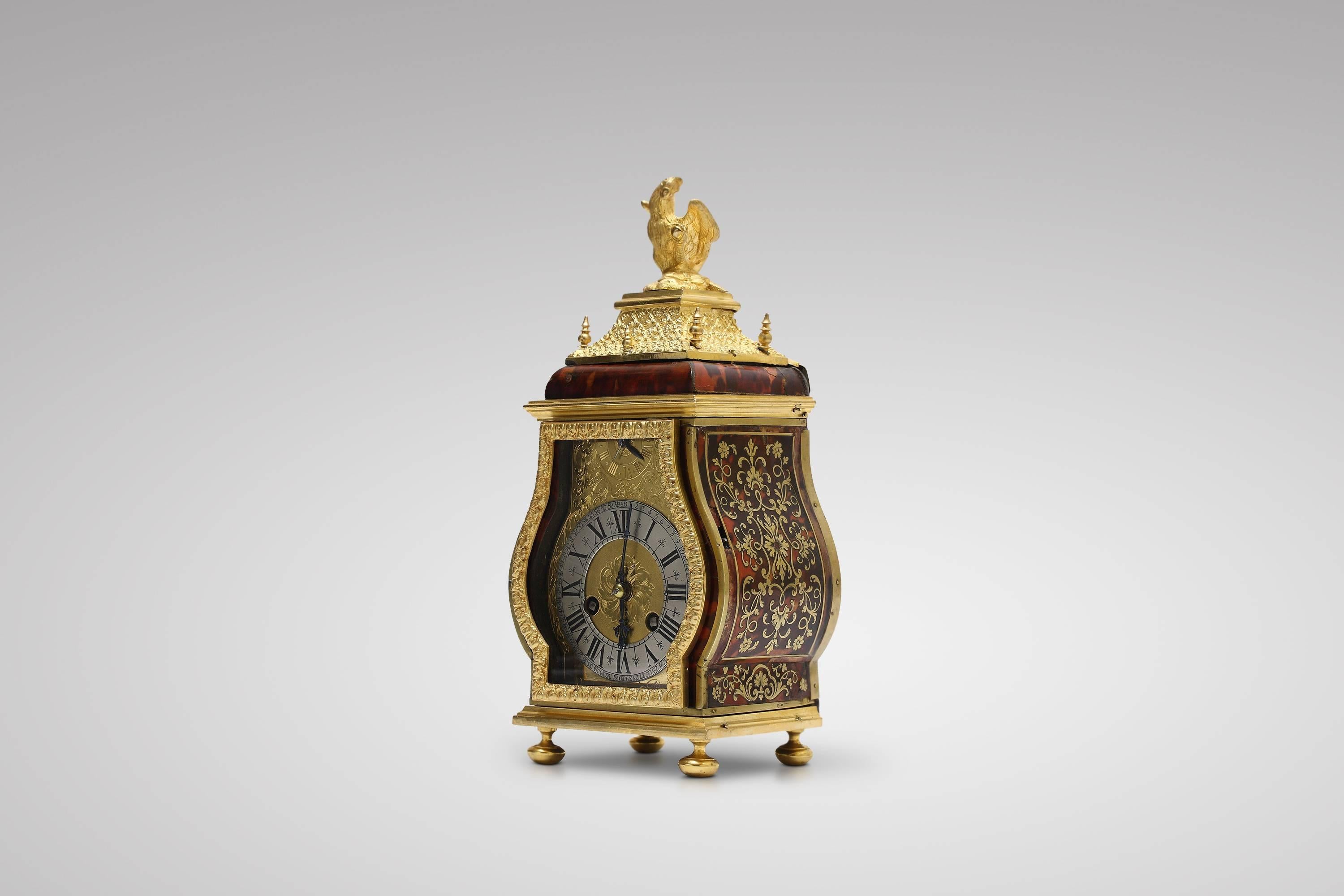 Very fine and small portable clock in turtleshell and brass veneer with ormolu decorations applied, signed Louis Ourry à Paris on the dial and the backplate. Very finely engraved and gilt dial with silvered chapter ring and blued steel hands.