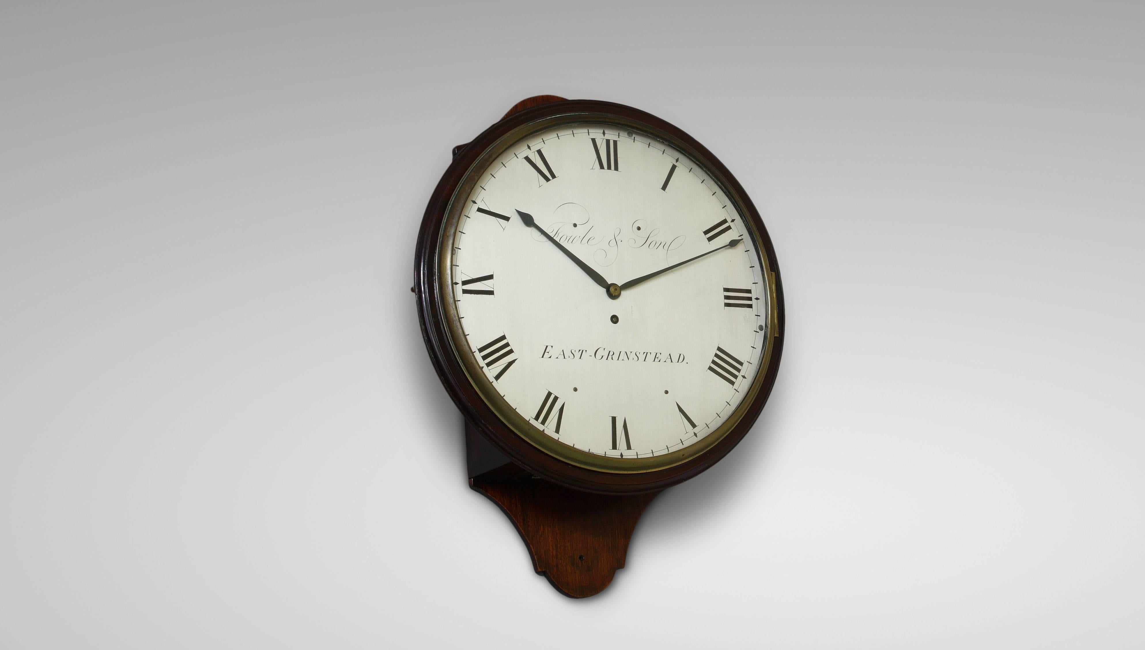 Mahogany wall timepiece, George III period, circa 1790 signed Fowle & Son, East Grinstead. Large silvered dial with Roman numerals bearing the signature, two blued steel spade hands. Mahogany salt box case, cast brass bezel and access clipped doors