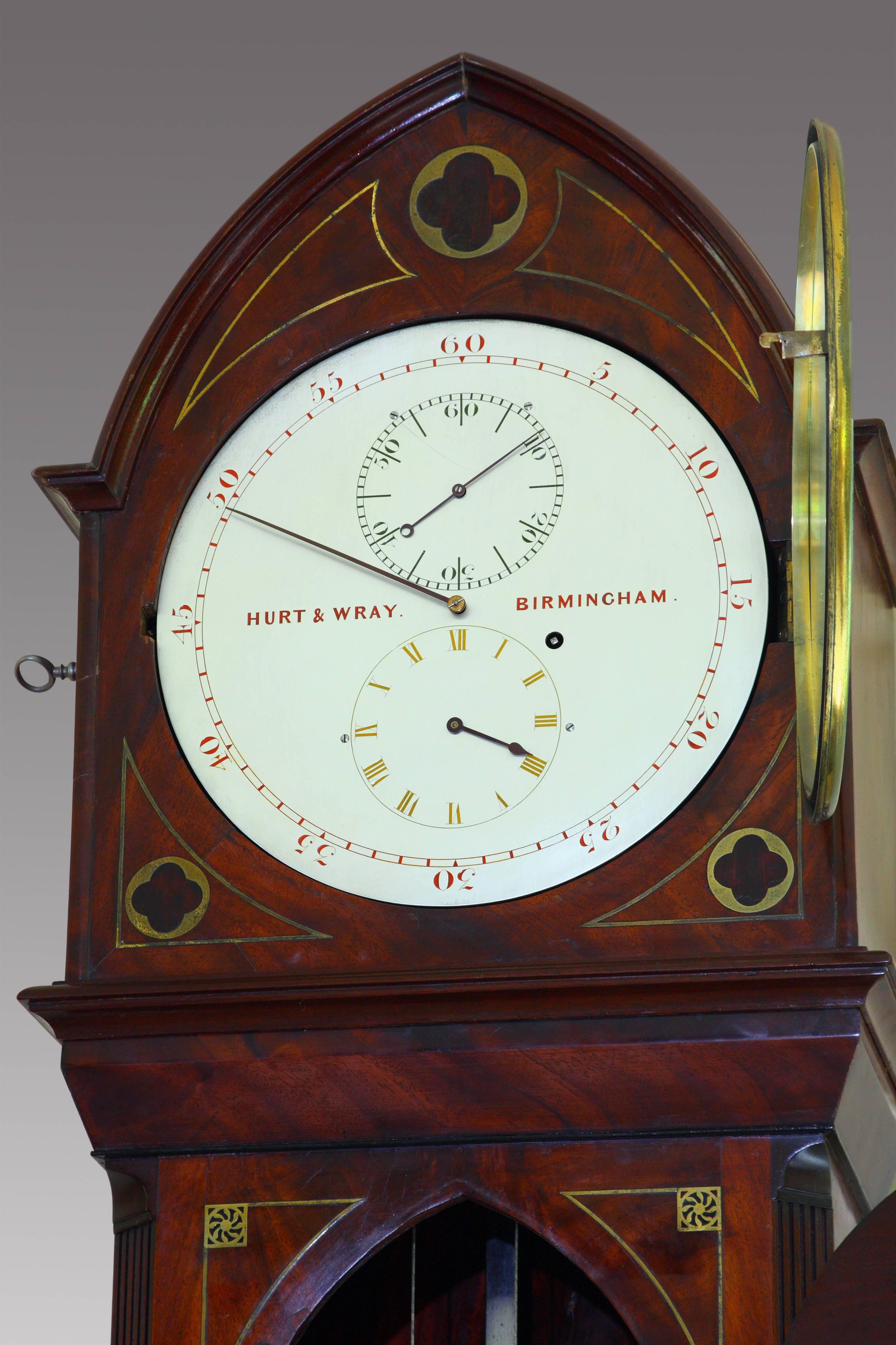19th century floor standing mahogany regulator, circa 1840, with unusual tri-colored dial and Ritchie's compensation to the pendulum, signed Hurt & Wray, Birmingham. Gothic-inspired case with lancet top over brass inlays of quatrefoils over a lancet