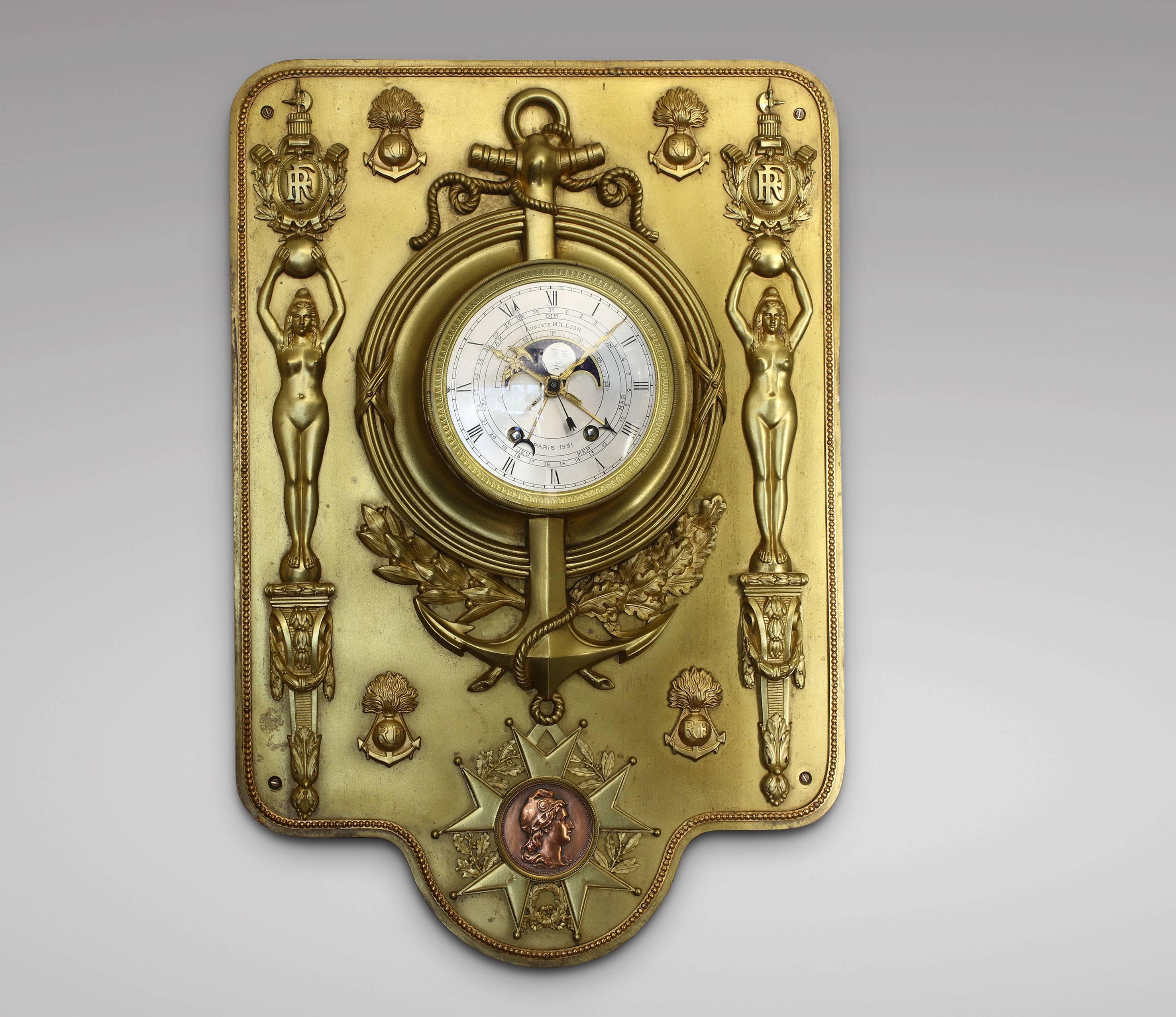 French Colonial Infantry Cartel clock, bronze with two-tone patina, the dial signed Auguste Million, Paris, 1931. Designed in the shape of a badge, the clock dial is transected by an anchor suspending the Cross of the Legion of Honour and flanked by