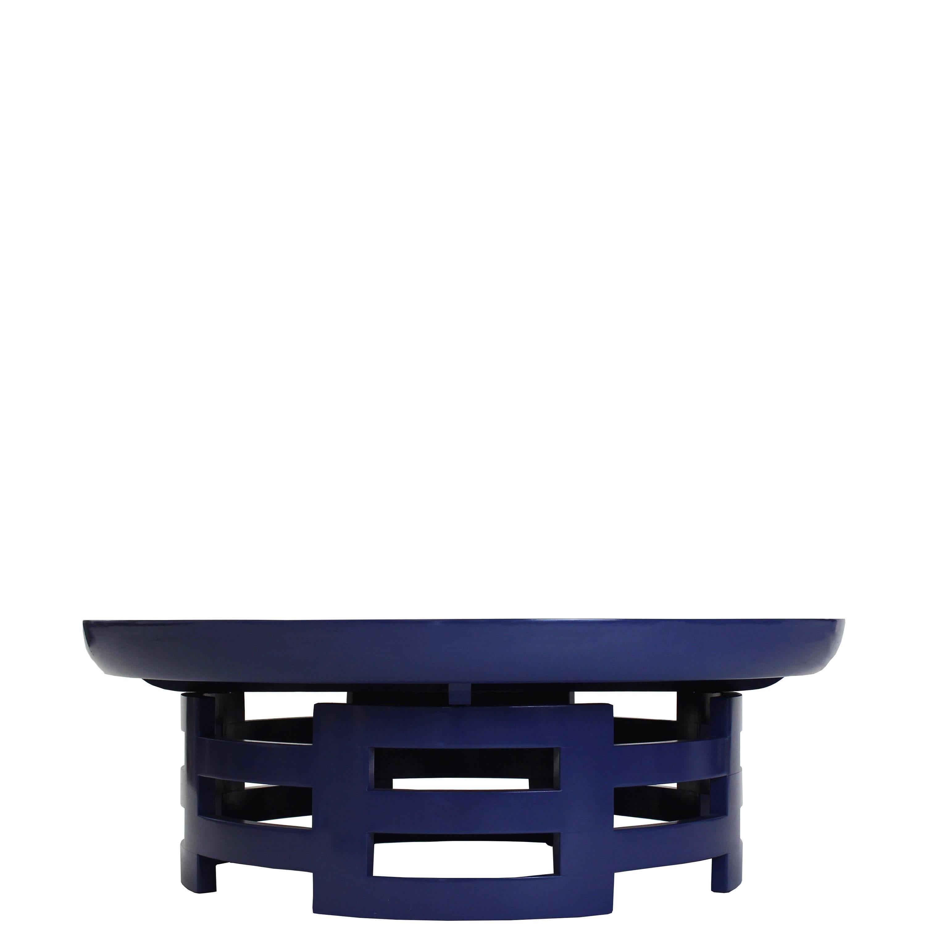 Our Kittinger-style low coffee table, shown lacquered in navy, is crafted in our Norwalk, CT workroom. Finish can be customized. 

Measurements: 14.5