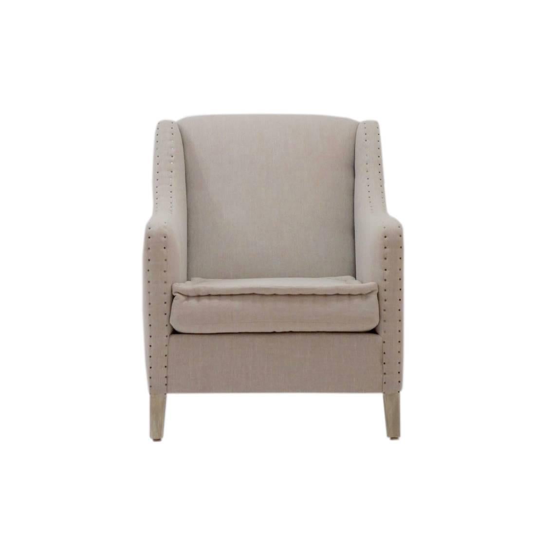 The Aspetuck club chair features exposed nailheads, the 