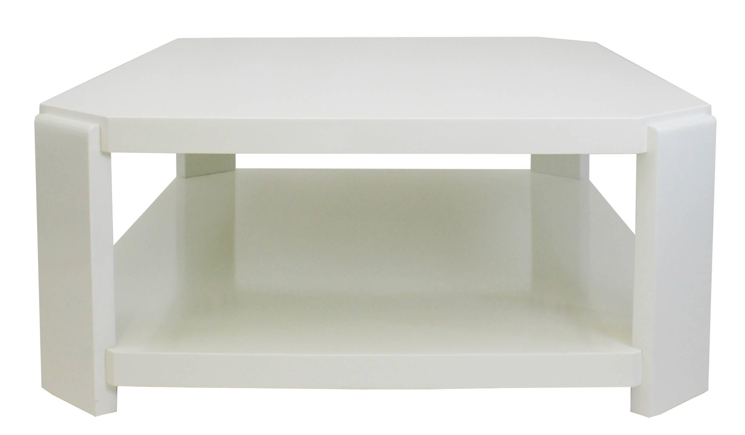 The ultra coffee table is a modern octagonal coffee table that has a rectangular shape and a lower shelf. Shown in white lacquer, color is customizable. 
Made to order in our Norwalk, CT workroom.