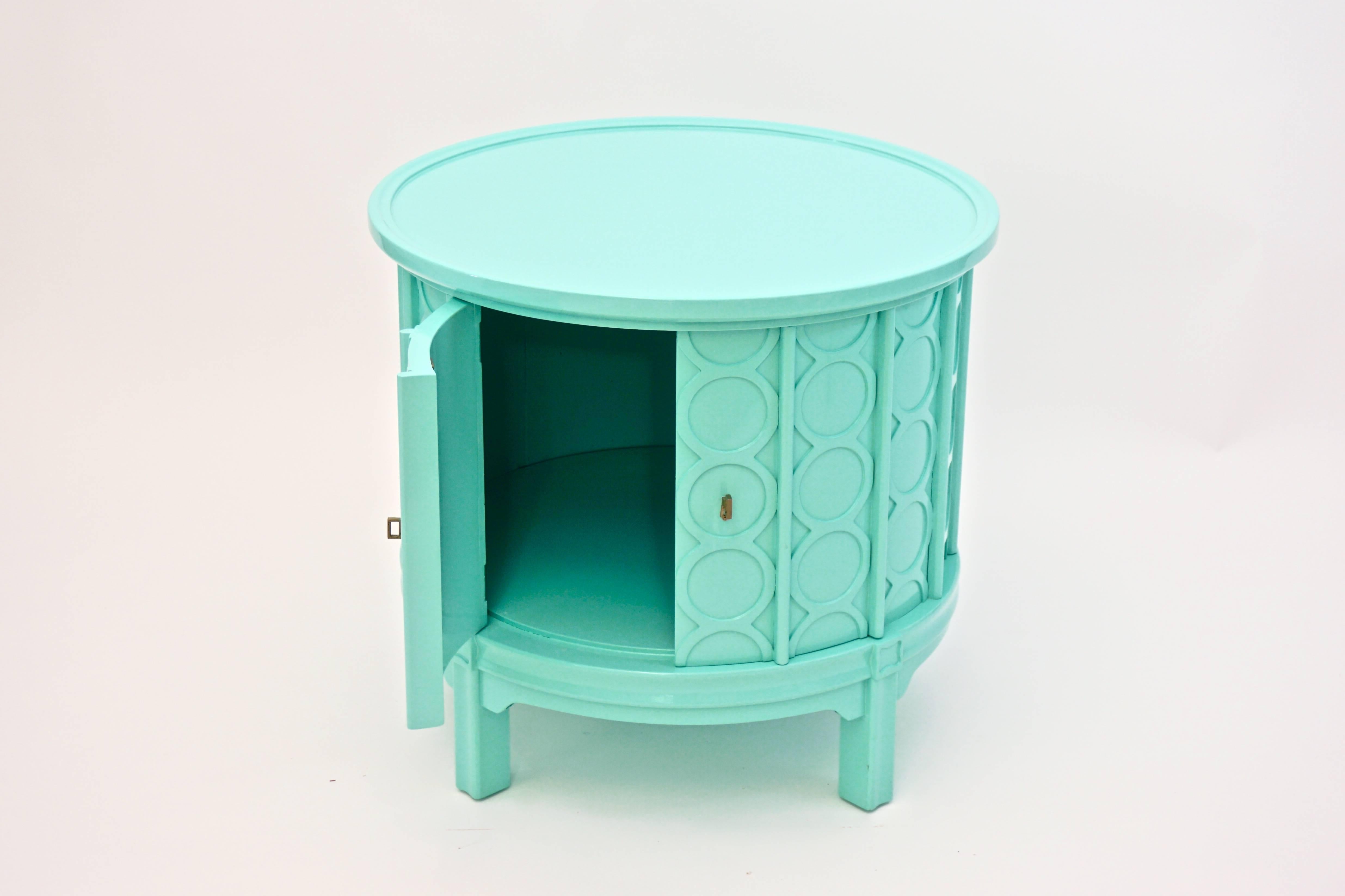 Mid-Century round Drum Side Table with carved circular detailing. Newly-lacquered in high-gloss turquoise finish.   Doors open to reveal interior storage.

