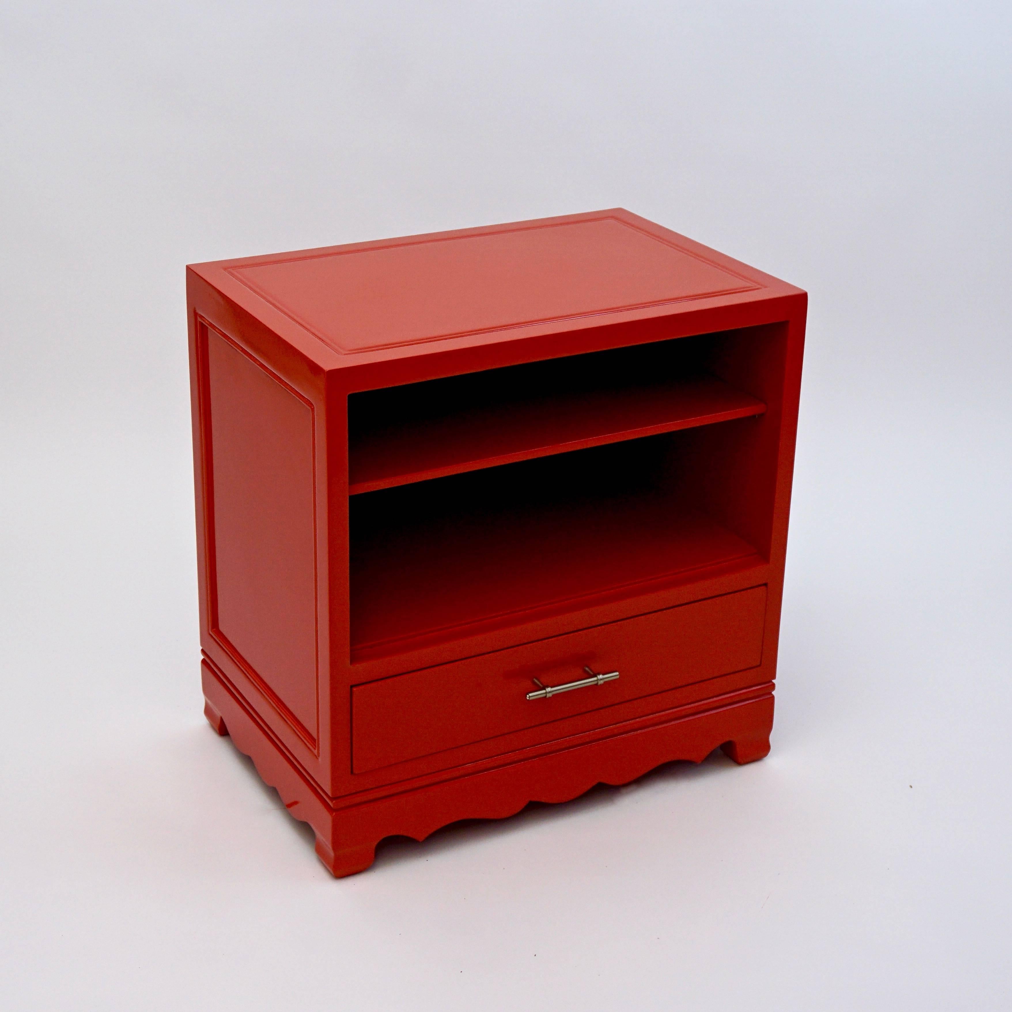 Retro Chic Vintage Side Table or Night Stand has shelves and bottom drawer for handy storage. Newly lacquered in gloss papaya color.  Carved skirt and polished nickel hardware.

