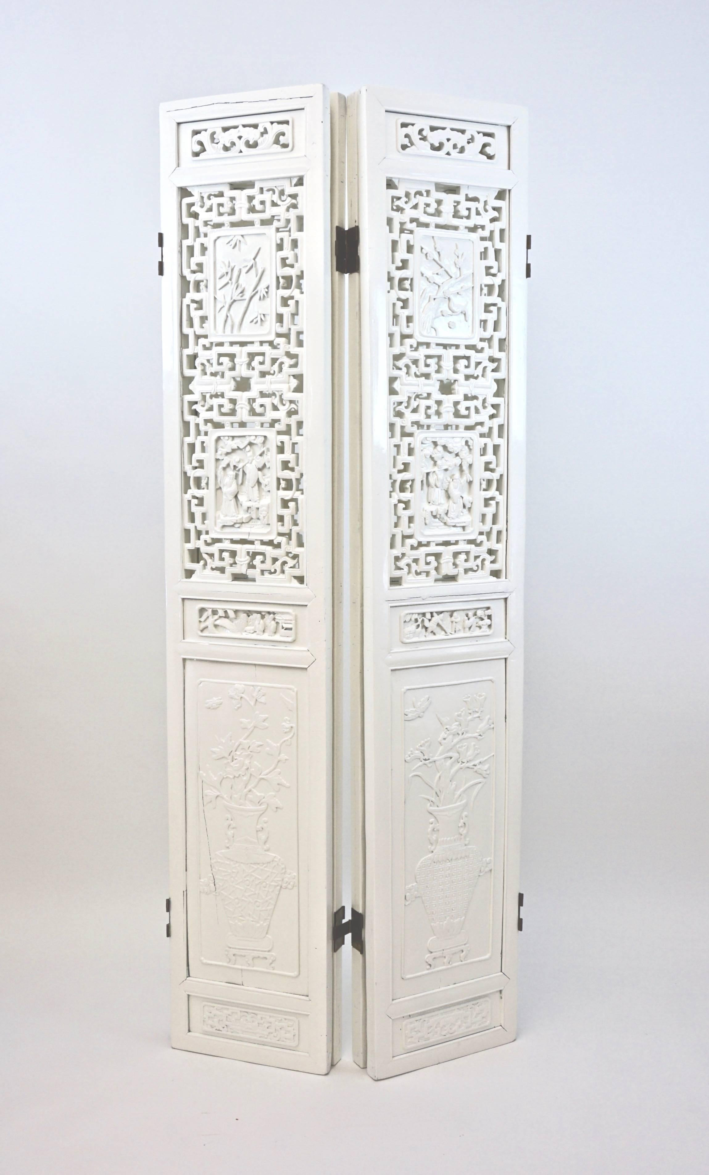 Vintage Asian 4-Panel decorative floor screen or room divider. Four Intricately carved pictorial panels feature detailed wood cut-through pattern. Newly Lacquered in Gloss Creme. Each panel measures 14.5