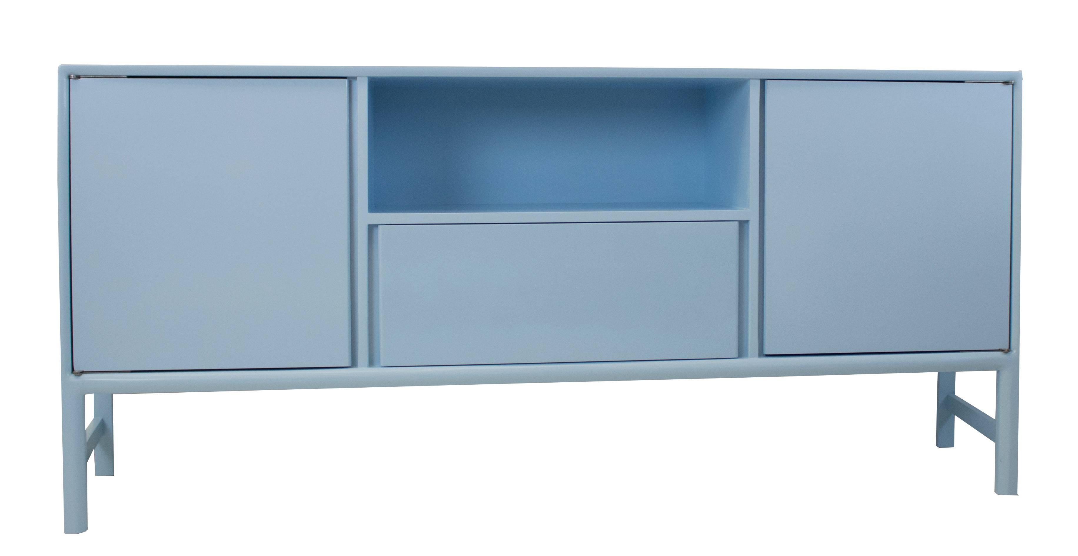 Lacquered in high gloss powder blue, this modern sideboard features cabinets, a drawer and a cubby / shelf. The sides of the piece angle inward. The overall footprint is shaped like a boomerang, with a subtle point on the back edge.

Overall: 76”W x