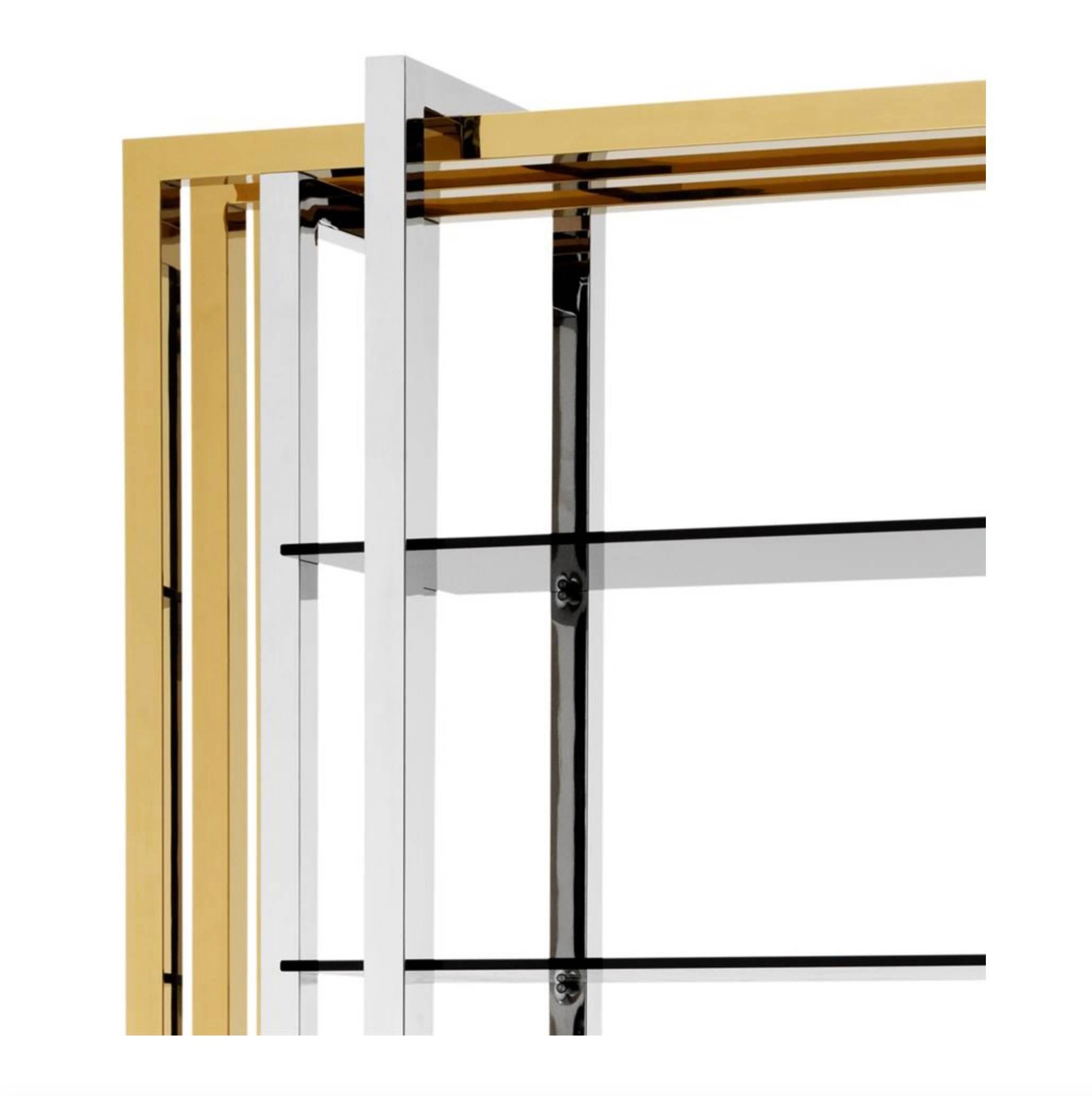 brass and glass shelving unit