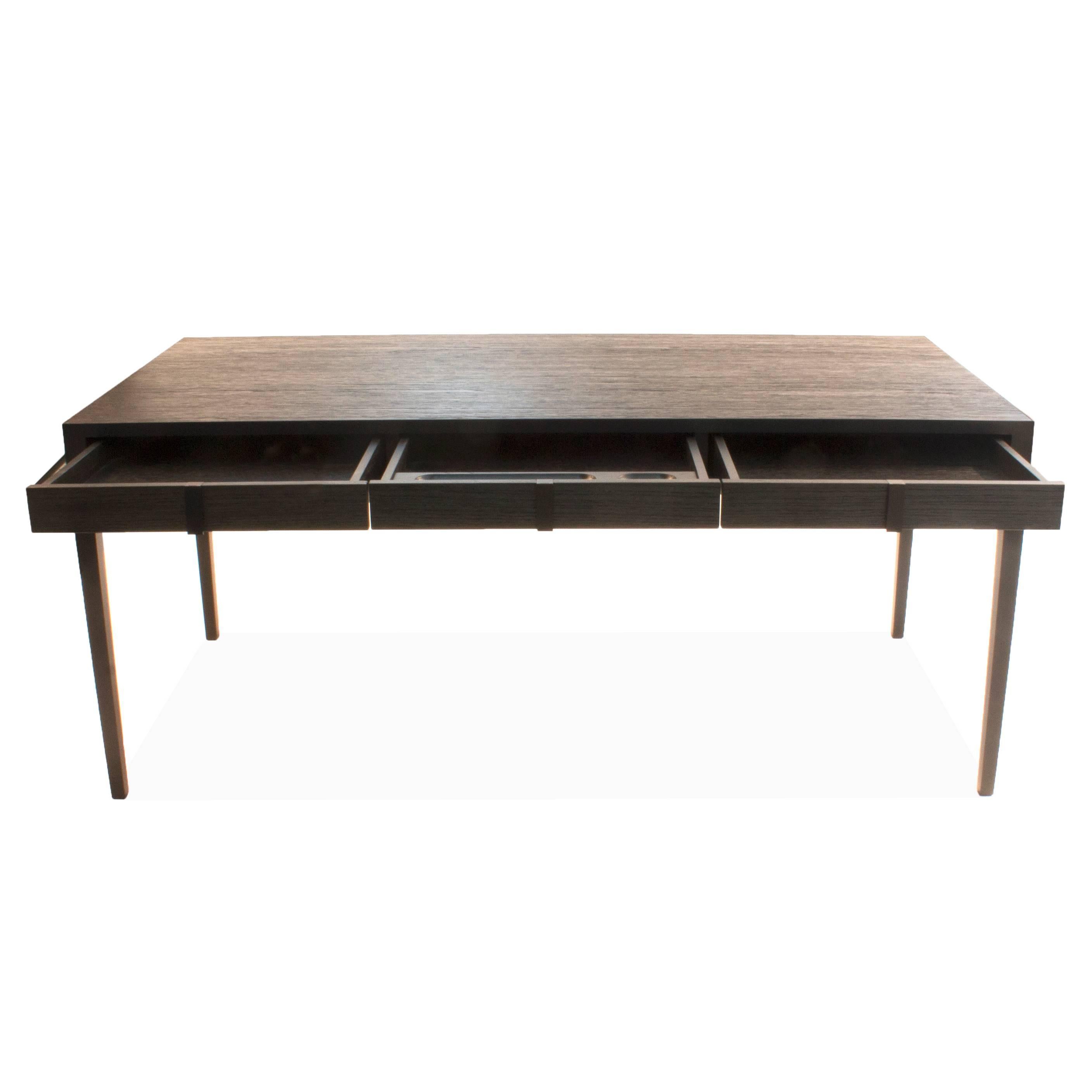 Metal frame desk with heavily wire brushed oak surface. Each drawer has a metal pull handle and center drawer has an organizer.