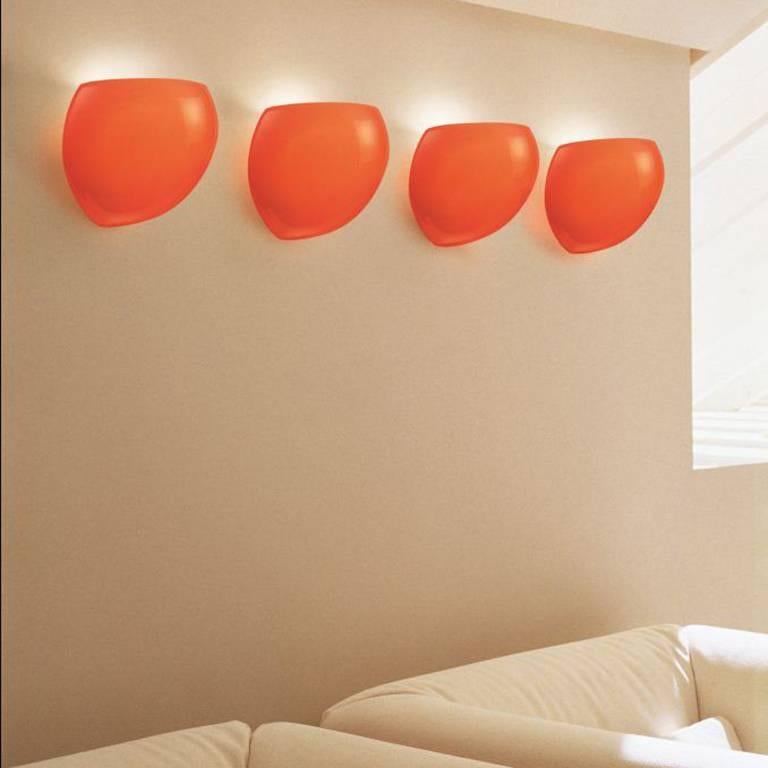 Globular wall sconce with satin blown glass diffuser.

Gloss orange, white structure, 1x 75W E26 bulb.