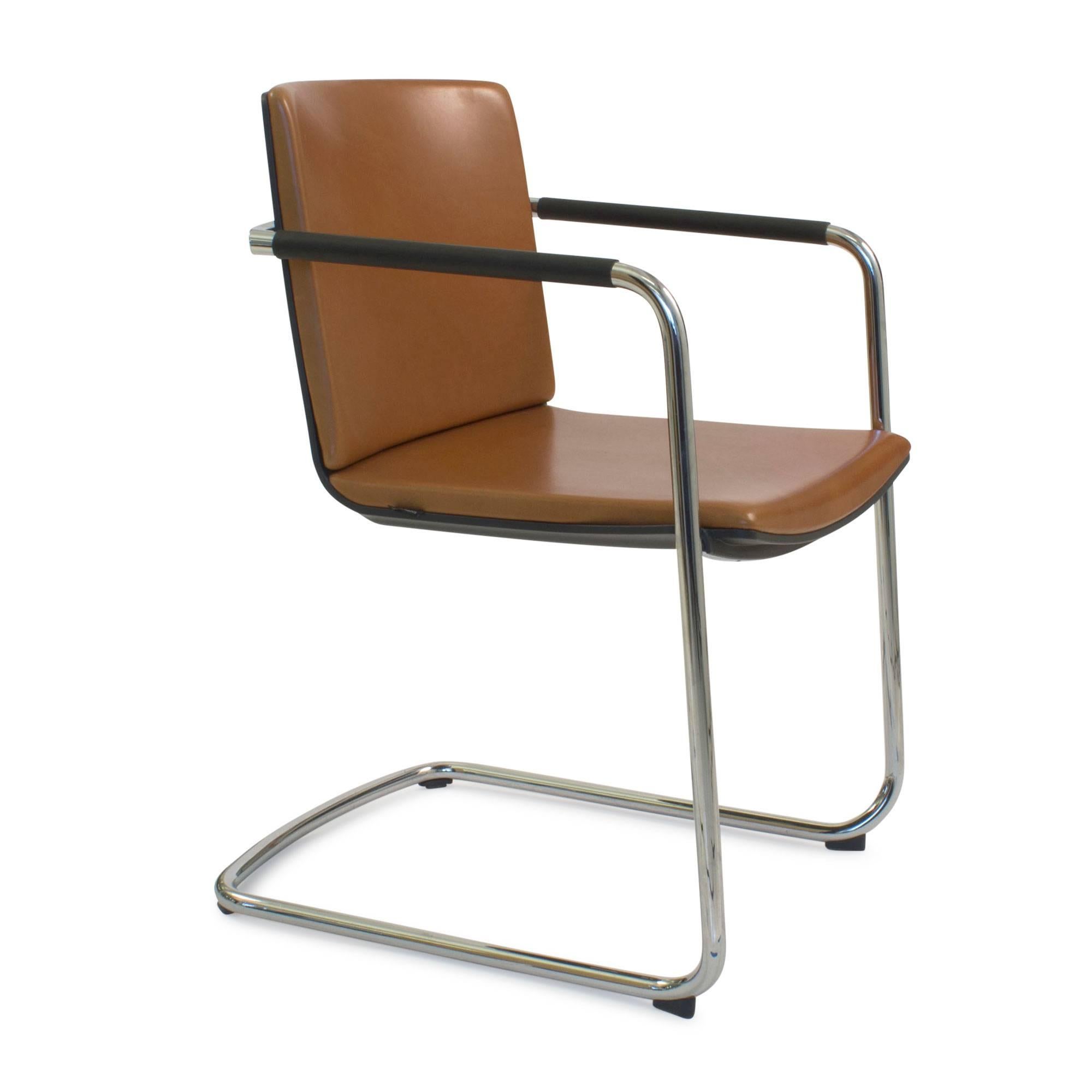 The cantilever chair consists of a slender, bright chromium-plated tubular steel frame connected to an elegant tapered outer rail. The space between the outer rail and the shell is not just simply a smart detail: the rail is also a handle and at the