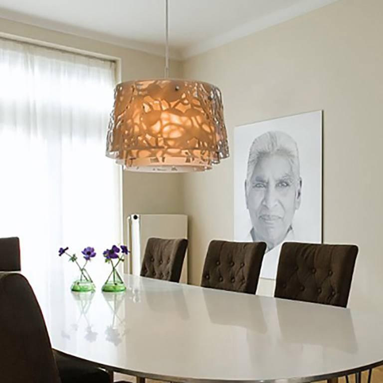 The fixture emits diffuse light directed primarily downwards. The patterns on the three laser cut acrylic shades have been carefully staggered with the aim of eliminating unpleasant glare from the light source. The patterns differ between the