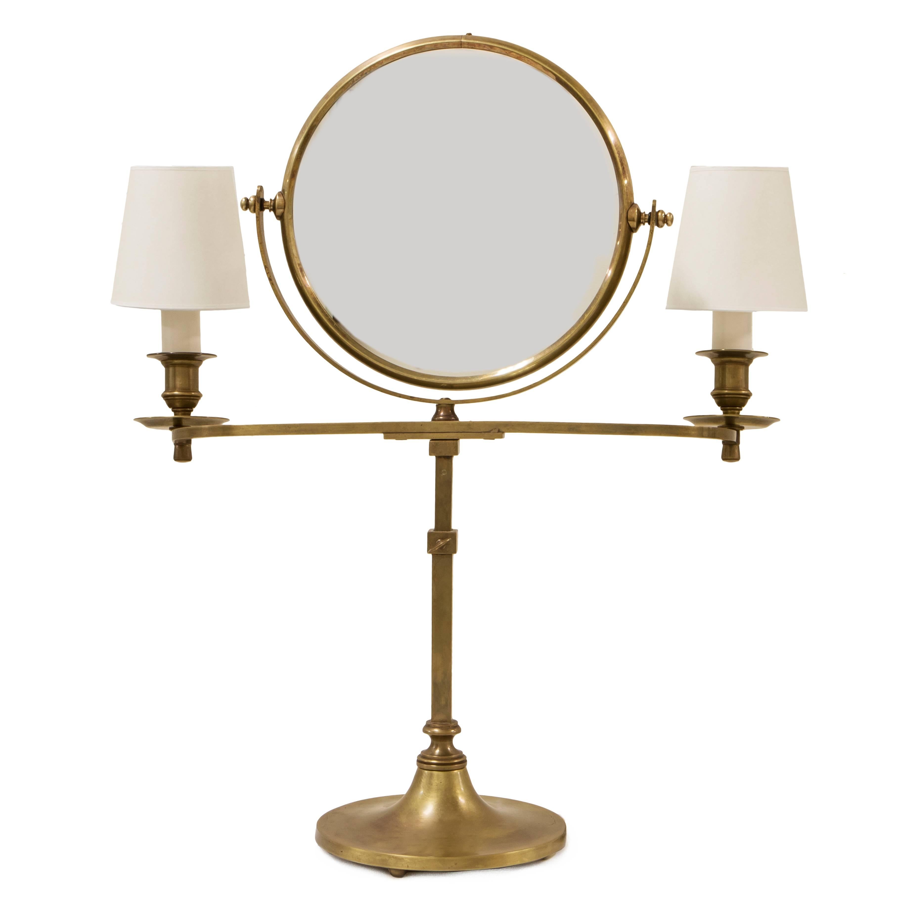 The flip mirror is a flat mirror on one side and a magnifying mirror on the other. Two candelabra base bulbs and clip on shades, on/off on cord. Comes with bulbs.
