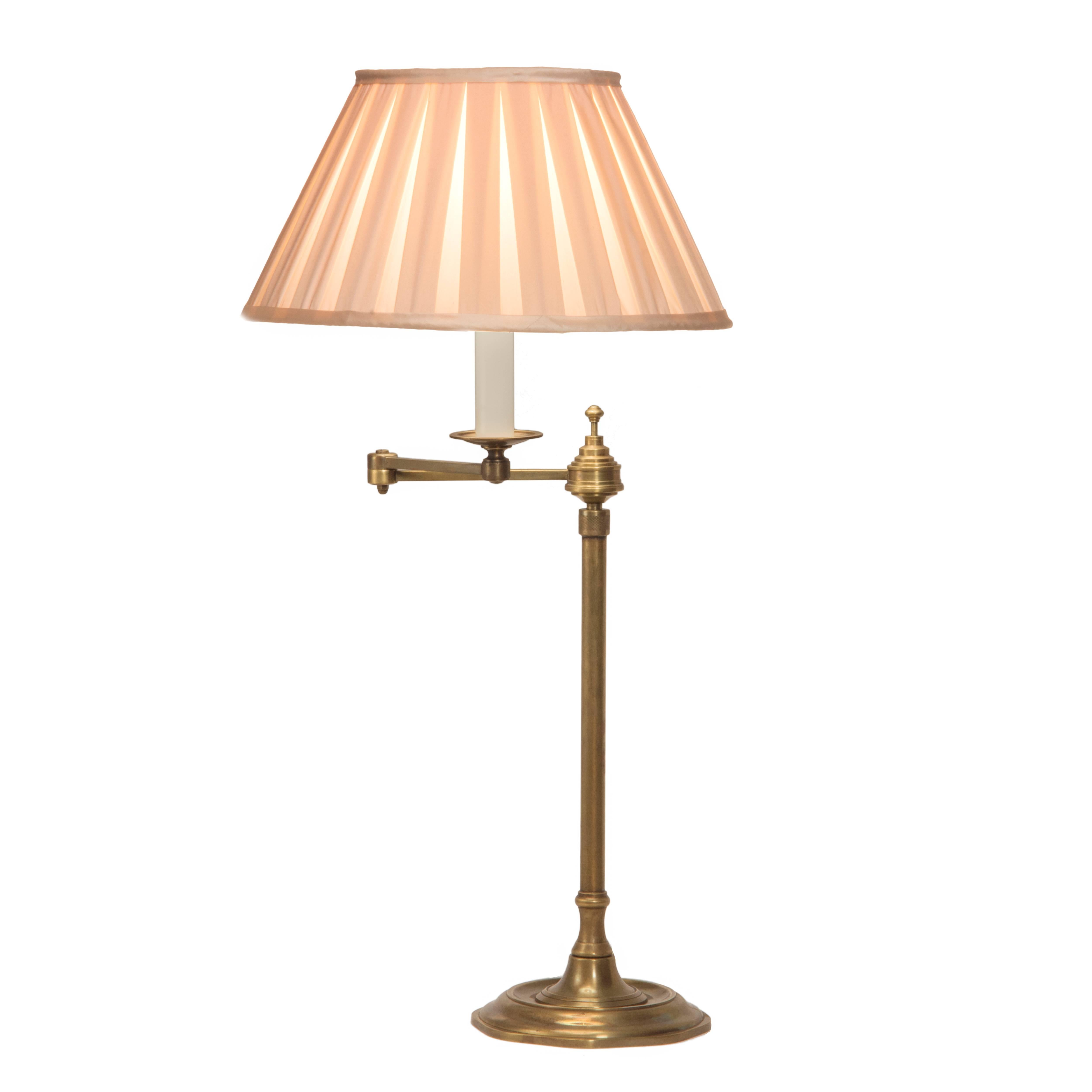 A single candle on a two section swing arm. Includes a paper parchment shade edged in grosgrain. Comes with One 75 watt incandescent standard base light bulb [E 26]. On/Off switch on the cord.

Measures: 28